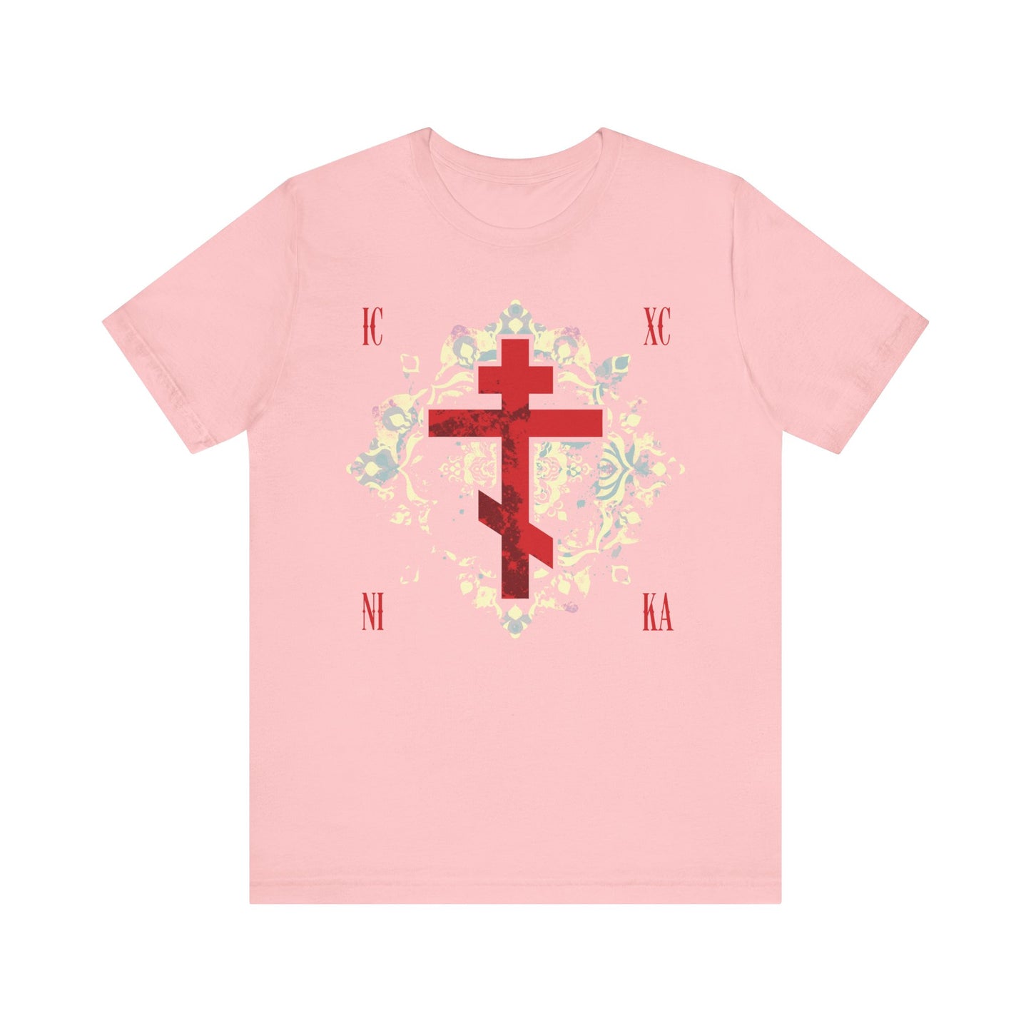 Pink ICXC NIKA Tee—features a textured red Orthodox cross, medieval floral background, and the inscription “Jesus Christ Conquers” in Greek; lightweight unisex cotton design to honor faith and tradition.