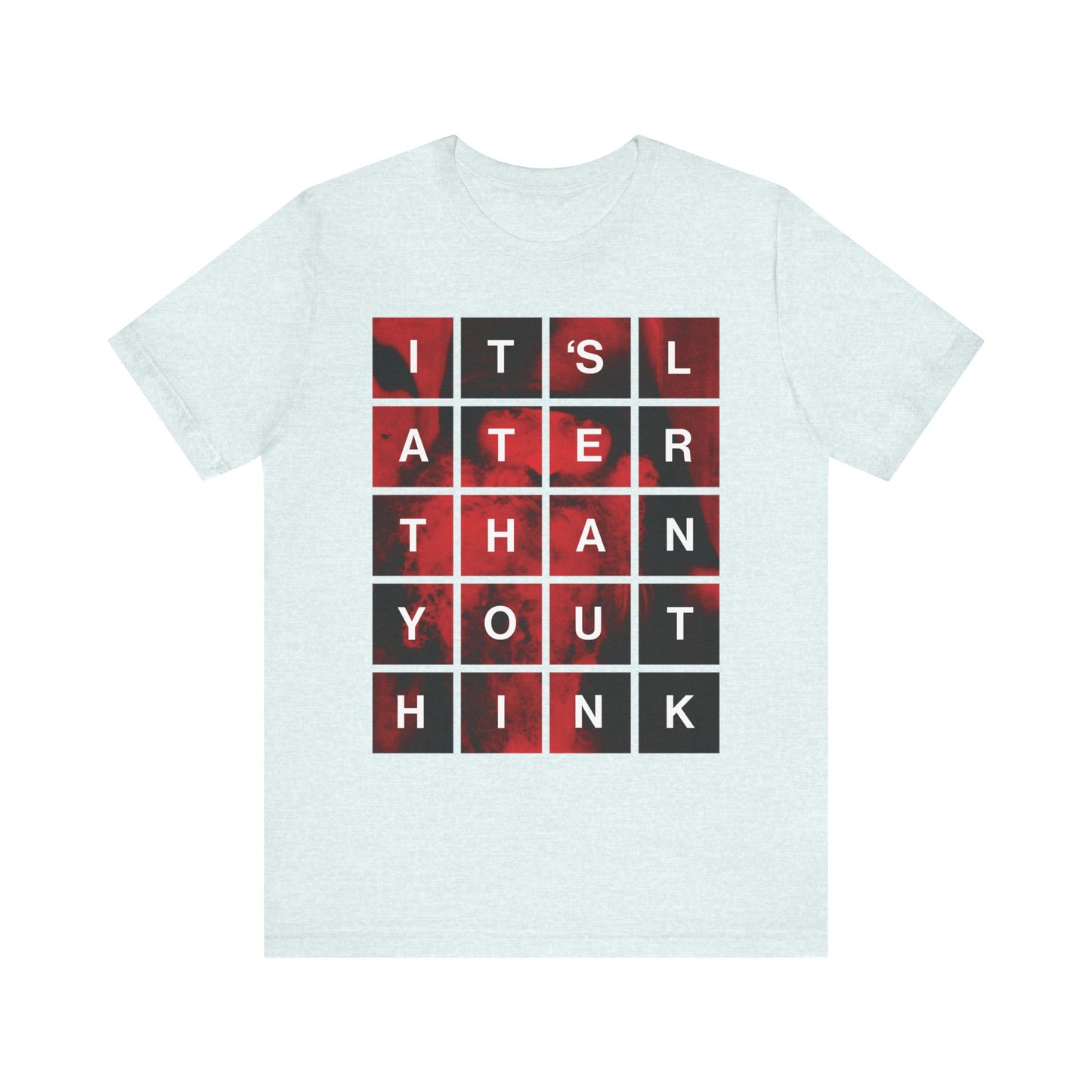Heather ice blue lightweight cotton unisex tee featuring a modern block grid design with the text "It's Later Than You Think"—inspired by St. Seraphim Rose—serving as a bold Orthodox Christian reminder of the urgency of repentance and embracing salvation in the Kingdom of God.