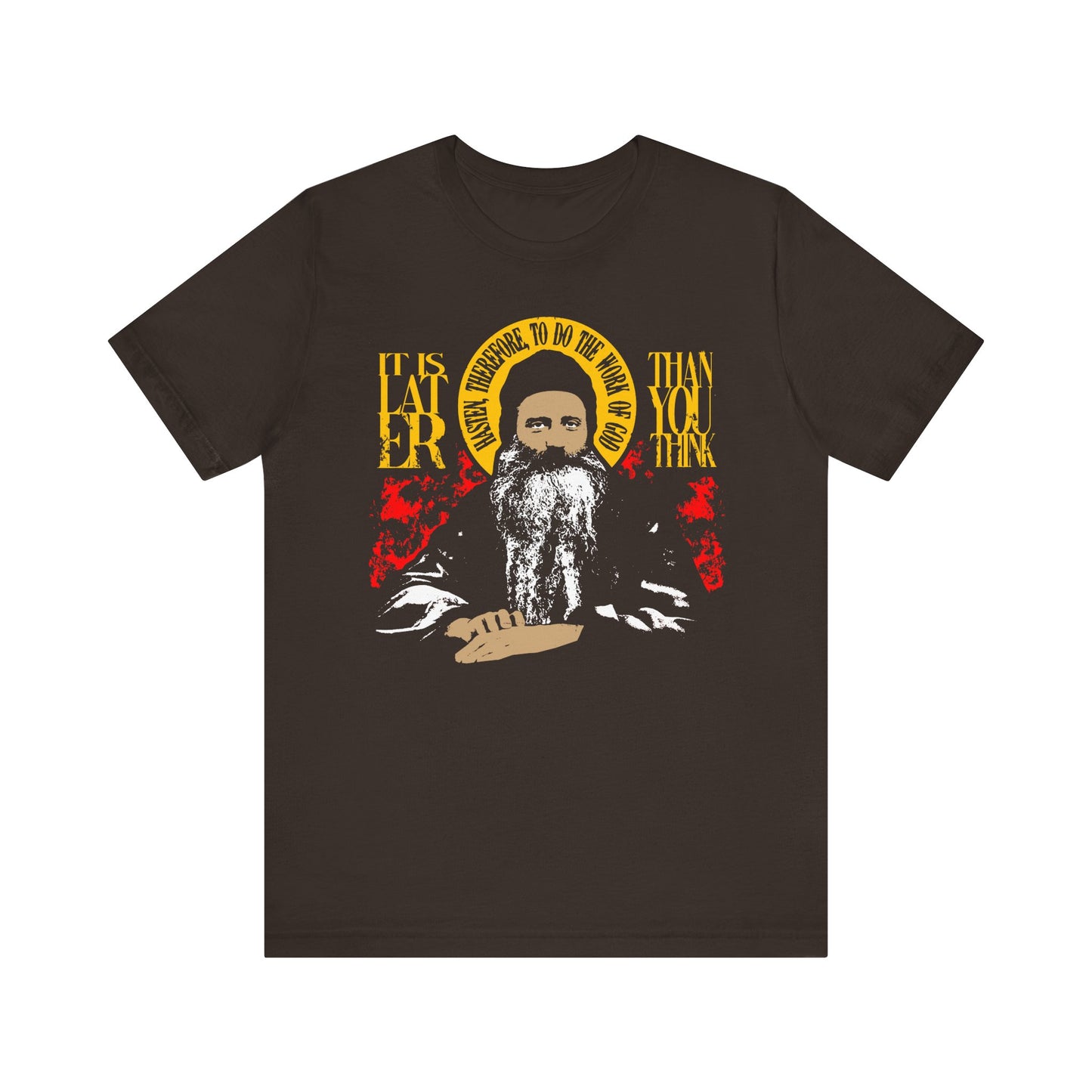 Brown t-shirt featuring a striking red and yellow design with the text: It is Later Than You Think, Hasten Therefore to Do the Work of God (Fr Seraphim Rose)—a thought-provoking piece inspired by Orthodox spiritual wisdom.