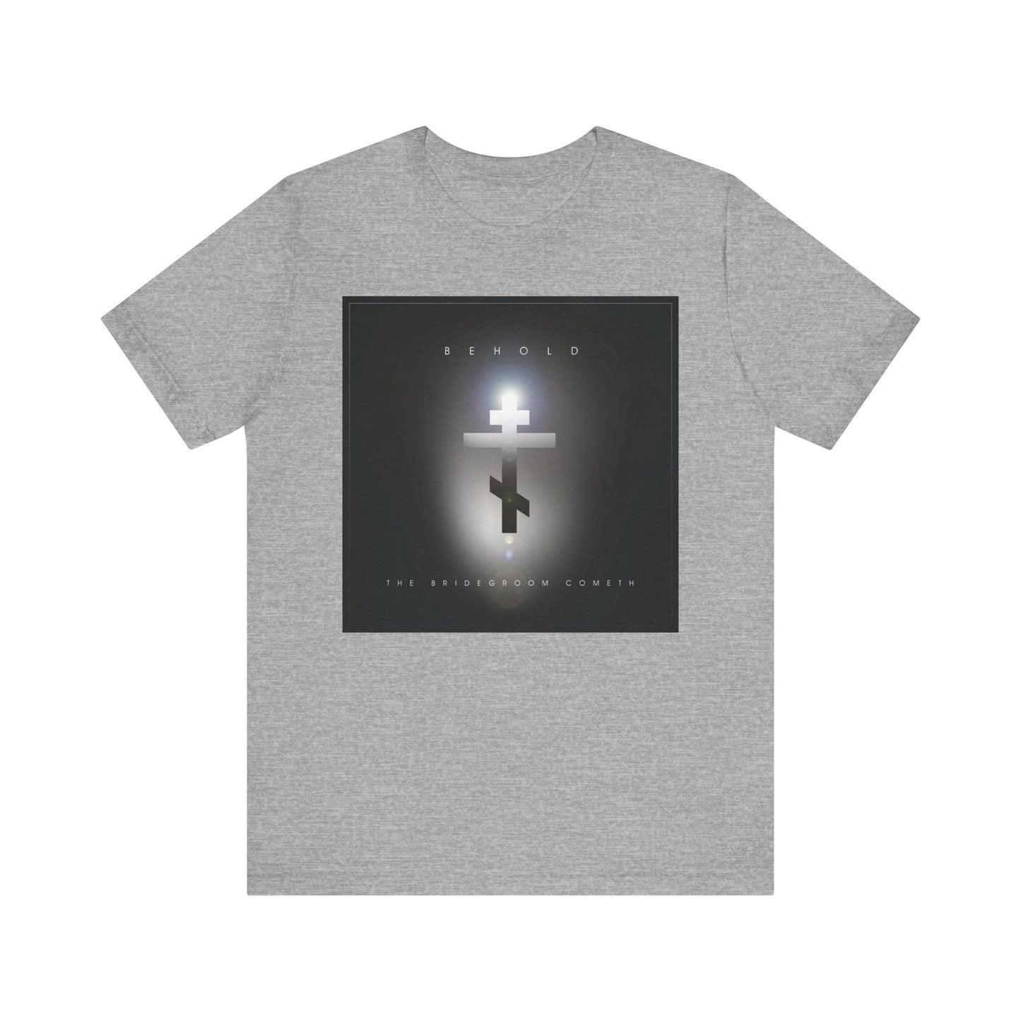 The “Behold the Bridegroom Minimalist Cinematic Lens Flare” Orthodox Christian t-shirt features a glowing cross and “Behold The Bridegroom Cometh” on the front, in Athletic Heather lightweight cotton.