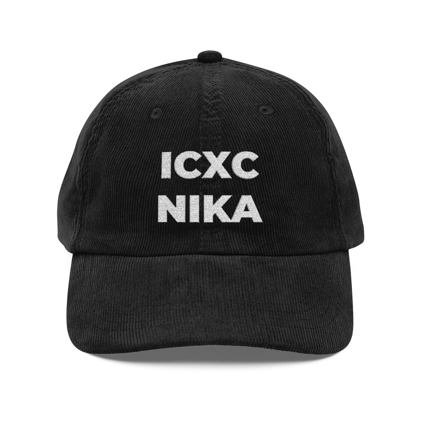 Black corduroy cap with white embroidered ICXC NIKA Christogram, meaning "Jesus Christ Conquers"—a classic Orthodox Christian symbol.