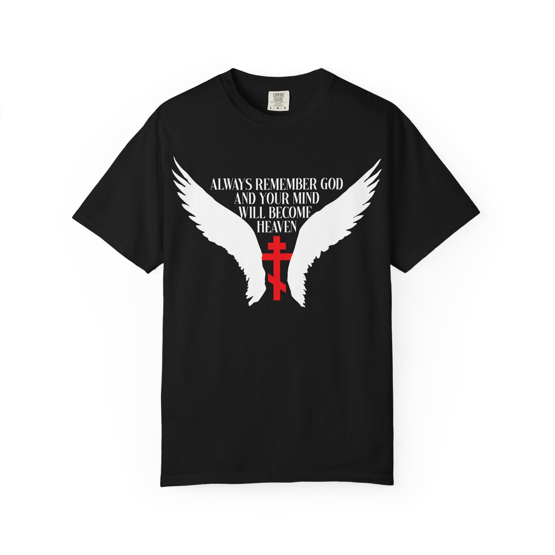 Wearing the “Always Remember God and Your Mind Will Become Heaven” heavyweight cotton unisex tee in black, featuring white angel wings, an Orthodox cross in red, and a meaningful quote inspired by St Neilos the Ascetic.