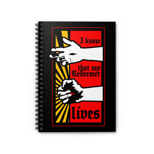 A black spiral notebook titled "I Know That My Redeemer Lives (Job 19:25)" features a comic book style design of resurrected Jesus’ fist with divine power, in bold red, yellow, and white art.