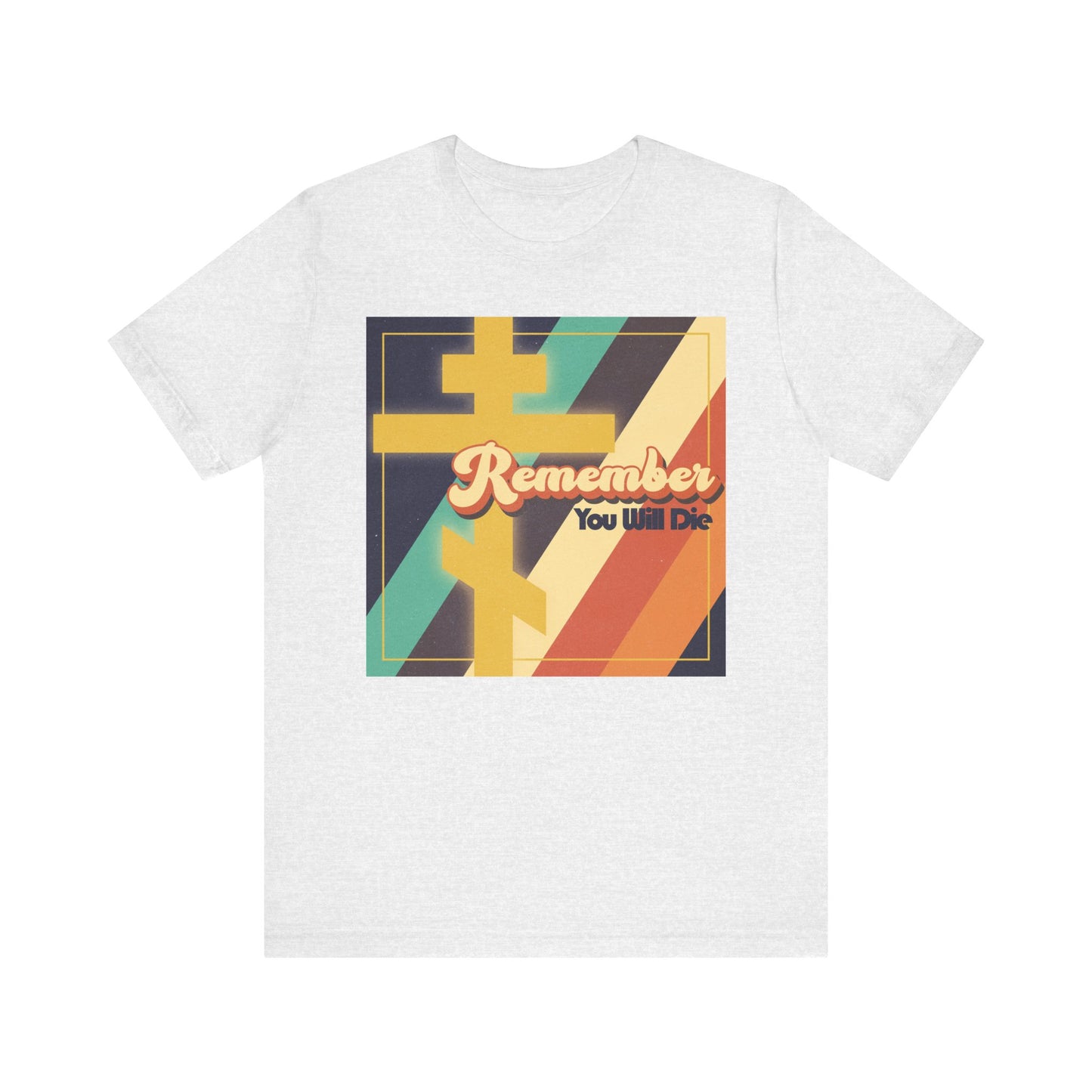 Ash-colored lightweight cotton unisex tee featuring "Remember You Will Die" in 70s retro typography over a bold, colorful American-inspired geometric background, accented with an Orthodox Cross—a striking Christian design that echoes Jesus’ message to the prodigal, urging reflection and renewal.
