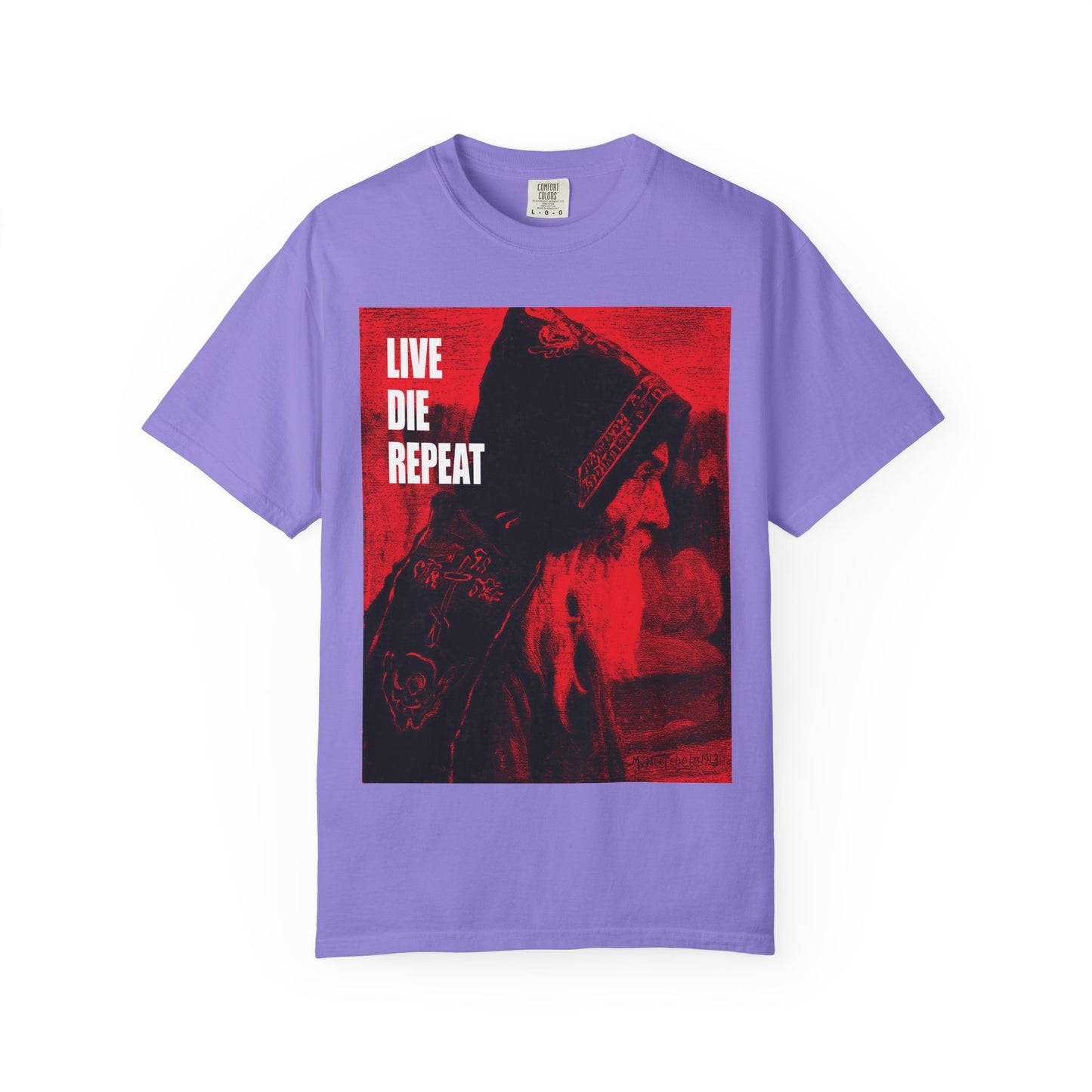 Violet heavyweight cotton tee featuring Mikhail Nesterov’s Orthodox Monk art and bold white “LIVE DIE REPEAT” text, inspired by St Antony the Great: Die every day, you will live forever. Unisex ascetic design.