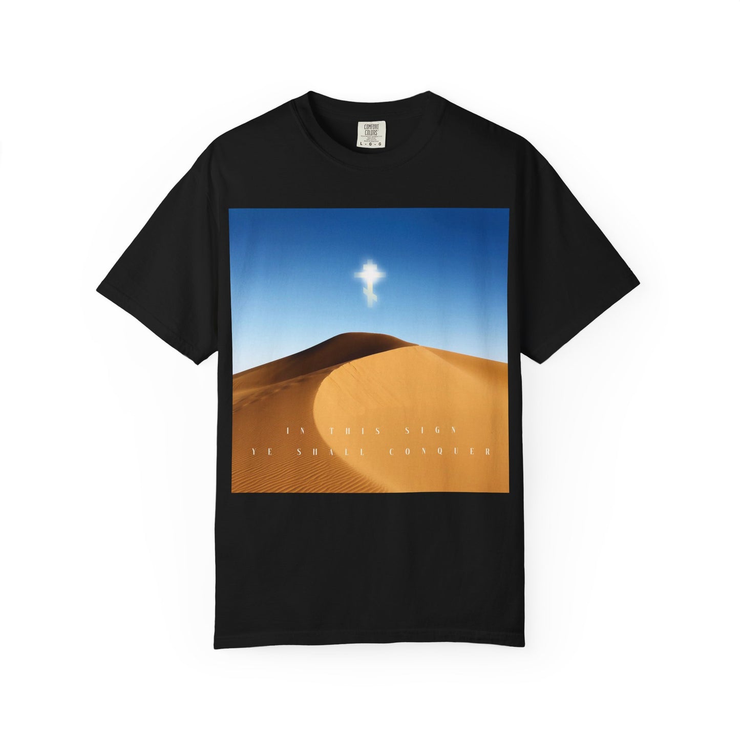 Black heavyweight cotton unisex tee, titled "In This Sign Ye Shall Conquer Desert Sun Scene | The Cross is the Might of Kings," featuring a desert sun scene with a glowing cross and the inscription: IN THIS SIGN YE SHALL CONQUER—a powerful Orthodox Christian tribute to the Elevation of the Cross and the enduring beauty of the Church.