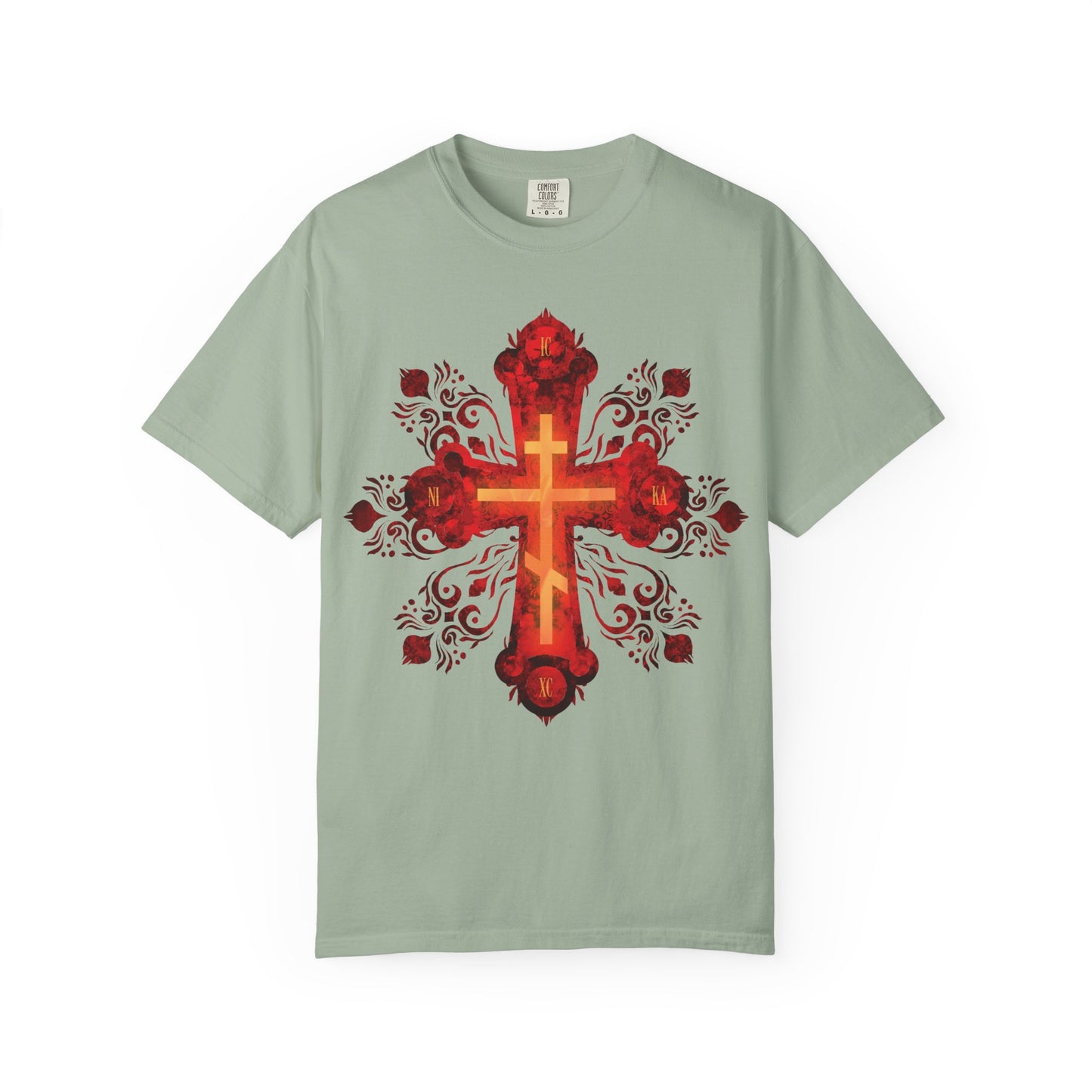 Bay green heavyweight cotton unisex tee featuring a large, ornate red and gold Russian-style Orthodox cross with decorative floral patterns at the center. Inspired by St. Herman of Alaska and the courage of a Christian warrior seeking their heavenly homeland. Product name: Red & Gold Ornate Russian Style Precious & Life-Giving Orthodox Cross | He was pierced for our transgressions.