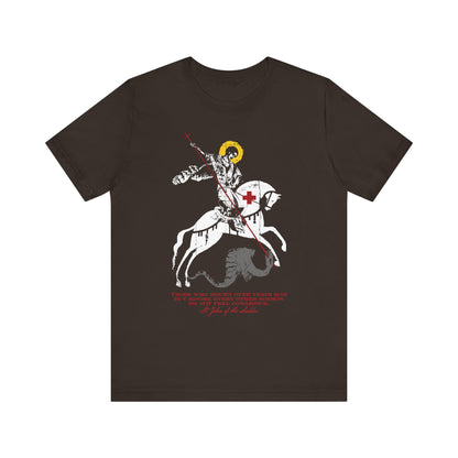 A bold brown lightweight cotton unisex tee, titled “Those Who Mourn Over Their Sins,” features an iconographic design of St. George slaying the dragon, inspired by St. John Climacus and Orthodox Christian tradition—a knight on horseback marked by sorrow for sins and godly mourning, adorned with text and a red cross on his chest.