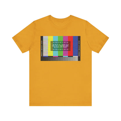 Mustard T-shirt featuring an Emergency Broadcast System TV graphic and "The End of All Things Is At Hand (1 Peter 4:7)" message, offering a vibrant apocalyptic Christian design in every detail.