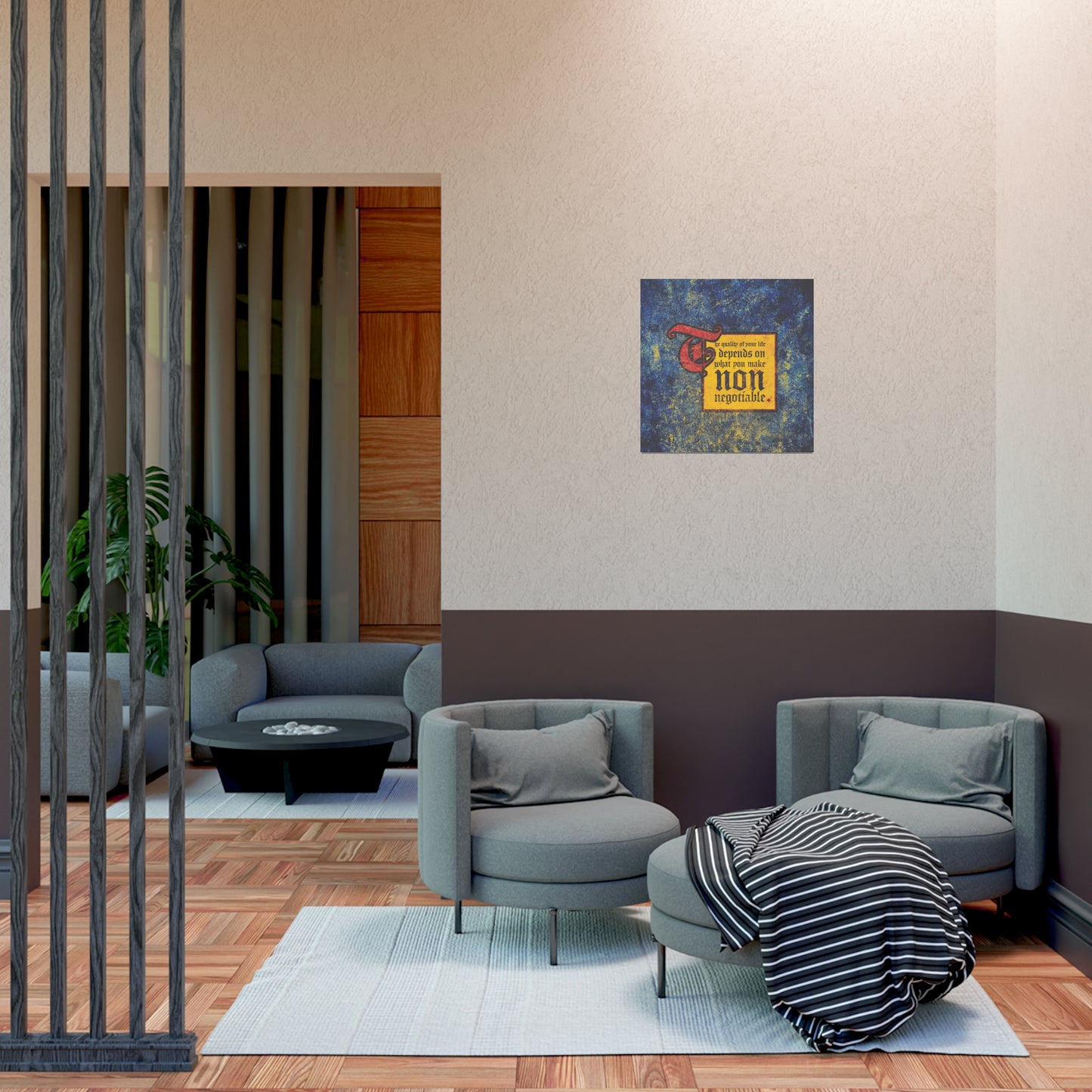 Modern lounge with two gray chairs, round ottoman, striped blanket for comfort, and the “The Quality of Your Life Depends on What You Make Non-Negotiable” Orthodox Christian Art Poster as a motivational finishing touch.