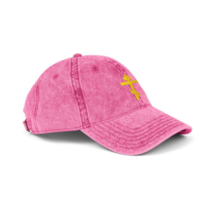 A pink minimalist distressed cap featuring a simple yellow Orthodox TriBar Cross, symbolizing salvation and faith—Crucify My Ego to the Precious and Life-Giving Cross.