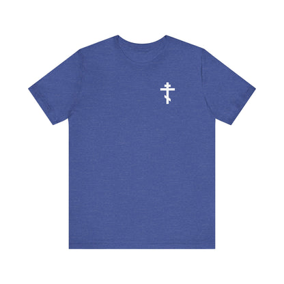 Heather True Royal "Dead to This World Skull and Cross" tee features a small white cross on the front left chest and skull with red rose graphic on the back. Lightweight cotton, unisex fit—perfect for goth aesthetics.