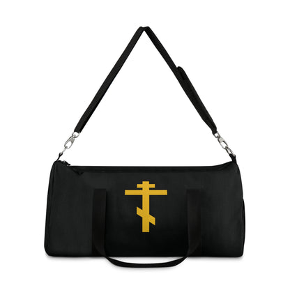 Black duffel bag with a yellow Orthodox cross on black background, inspired by “Precious and Life-Giving Weapon of Unseen Warfare”—an Orthodox Christian gym bag for those who cherish faith in daily life.