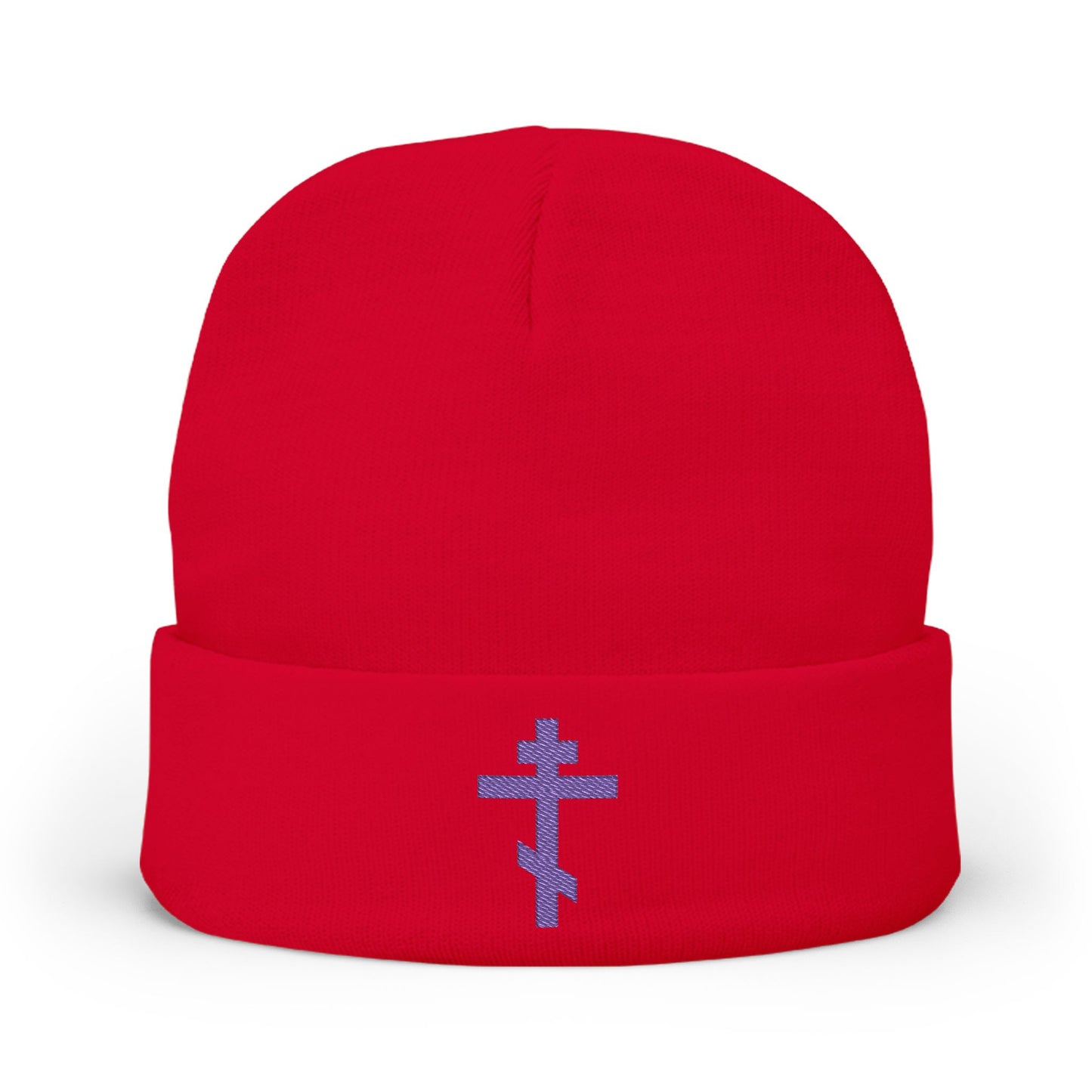 Red beanie featuring a blue-purple Orthodox TriBar cross embroidered on the front with "Nail My Passions to the Wood of Thy Precious Cross O Lord," symbolizing Christ and salvation.