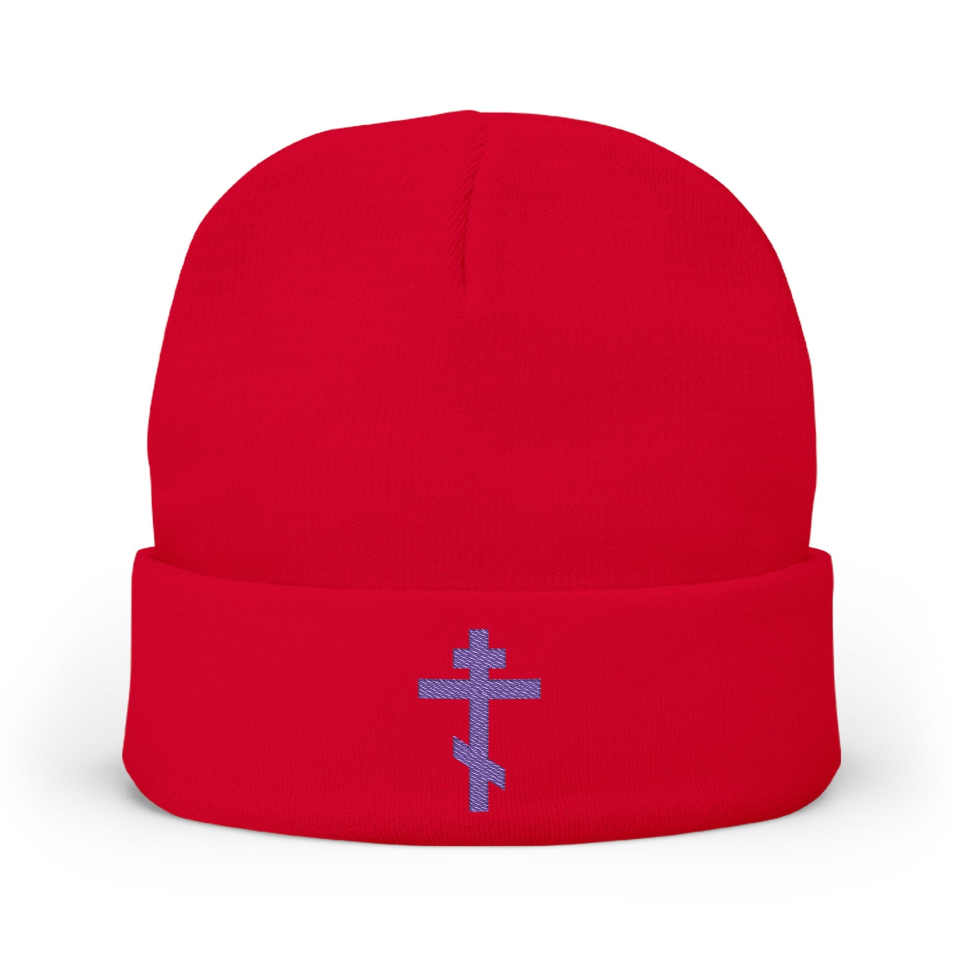 Red beanie featuring a blue-purple Orthodox TriBar cross embroidered on the front with "Nail My Passions to the Wood of Thy Precious Cross O Lord," symbolizing Christ and salvation.