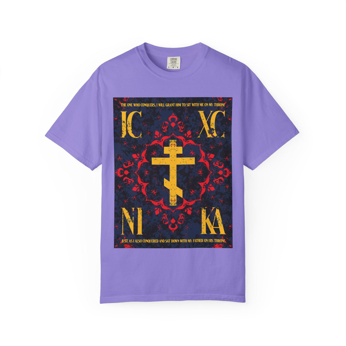 Violet IC XC NIKA Orthodox Cross heavyweight cotton unisex t-shirt featuring a medieval floral design with an ornate cross and religious text in red, yellow, and black on the front, highlighting “The One Who Conquers” message from Revelation 3:21.