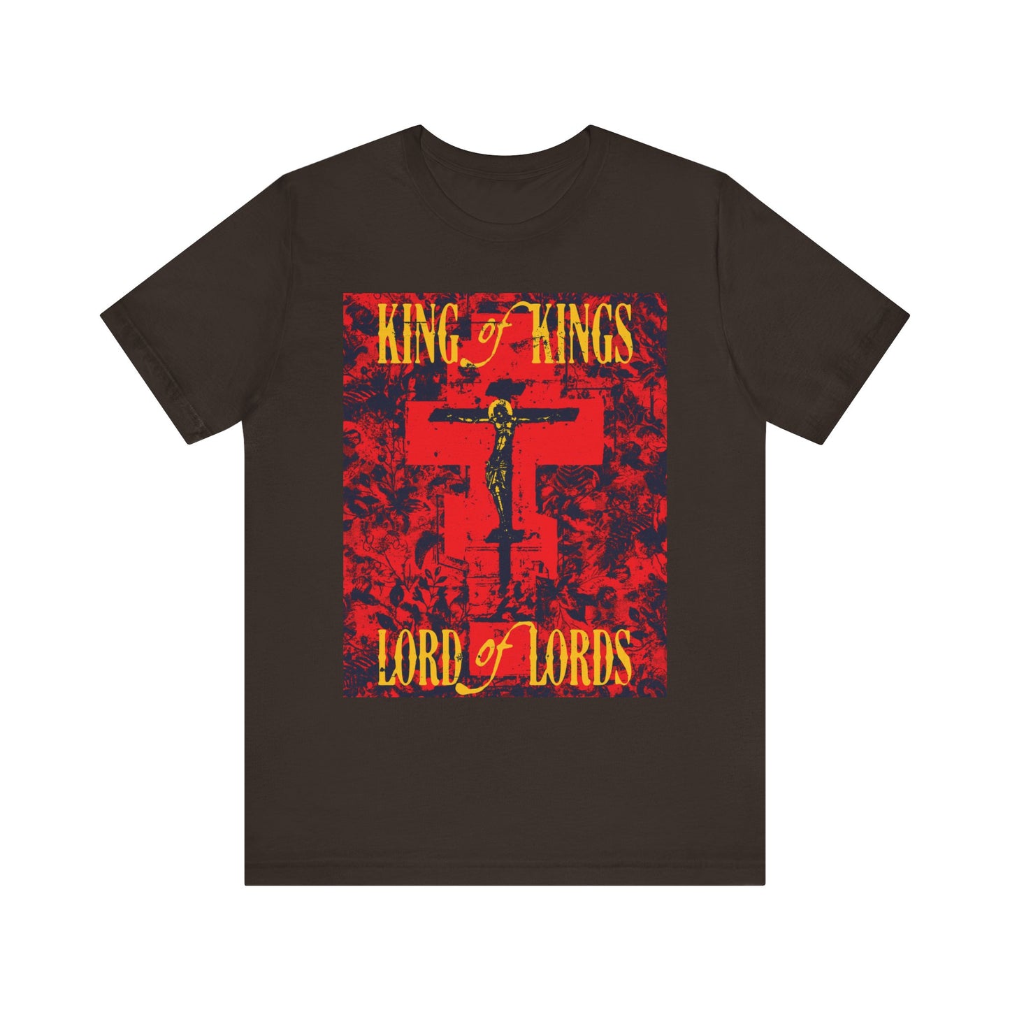 Brown t-shirt featuring a striking yellow and red "King of Kings, Lord of Lords" design with an Orthodox icono-graphic cross and Jesus at the center, boldly proclaiming Christ crucified and celebrating the truth of the Word of God. Made from lightweight cotton with a unique nature texture; unisex fit.