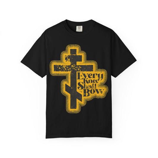 Black heavyweight cotton unisex tee featuring a bold, distressed halftone 70s comic book aesthetic with a large yellow cross and the words “Every Knee Shall Bow,” inspired by Philippians 2:10-11 and Isaiah 45:23—a powerful reminder that Jesus Christ is Lord.