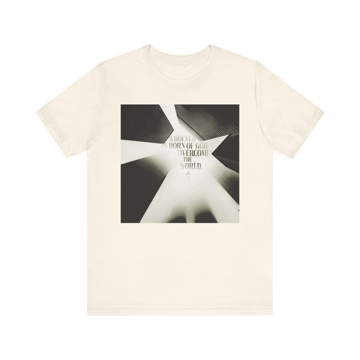 Natural-colored unisex T-shirt featuring a modern cityscape design and the text: "Whoever is Born of God Overcomes the World," inspired by 1 John 5:1-4 (St. John the Theologian). Orthodox Christian, lightweight cotton.