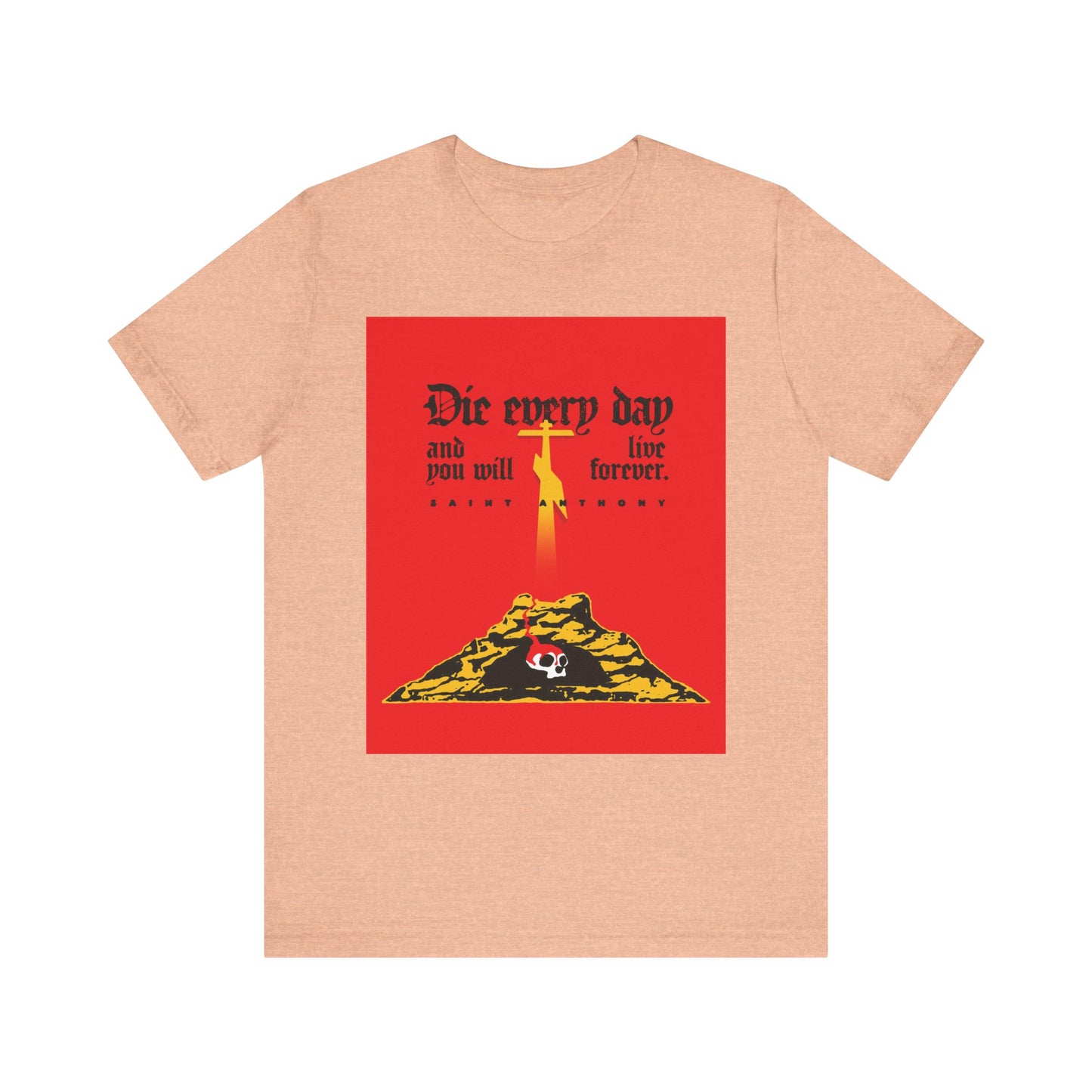 Heather Peach unisex tee with red Golgotha cross and Skull of Adam design, featuring “Die Every Day and You Will Live Forever,” inspired by St Anthony the Great. Lightweight cotton.