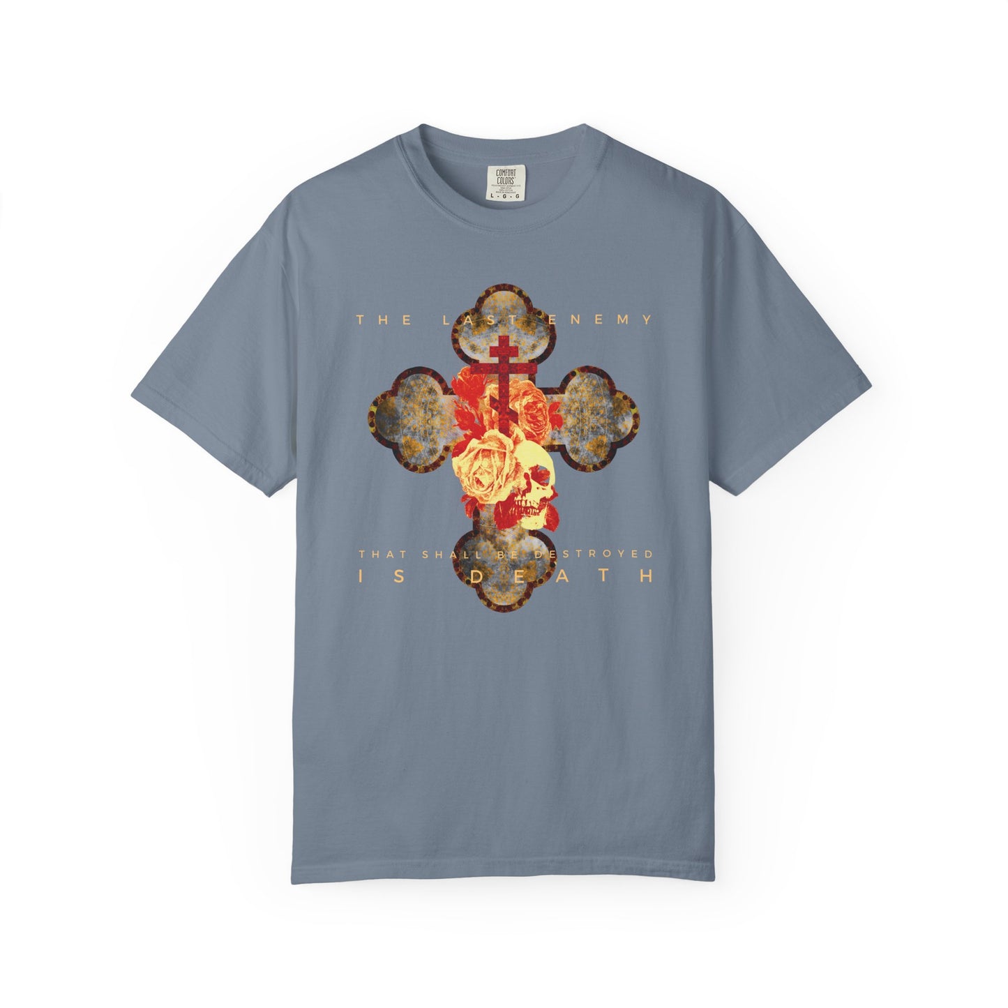 Blue Jean heavyweight cotton unisex t-shirt featuring a metallic gothic cross with rose and skull, and the phrase “The Final Enemy That Shall Be Destroyed Is Death” (1 Cor 15:26).