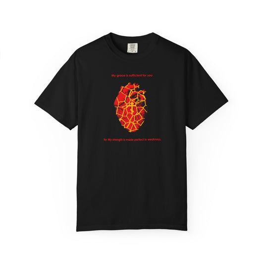 Black heavyweight cotton unisex tee featuring a kintsugi-style golden broken heart with an Orthodox cross, and the words "My Strength is Made Perfect in Weakness (2 Cor 12:9)" above and below the design, symbolizing grace and finding beauty through healing what was once broken.
