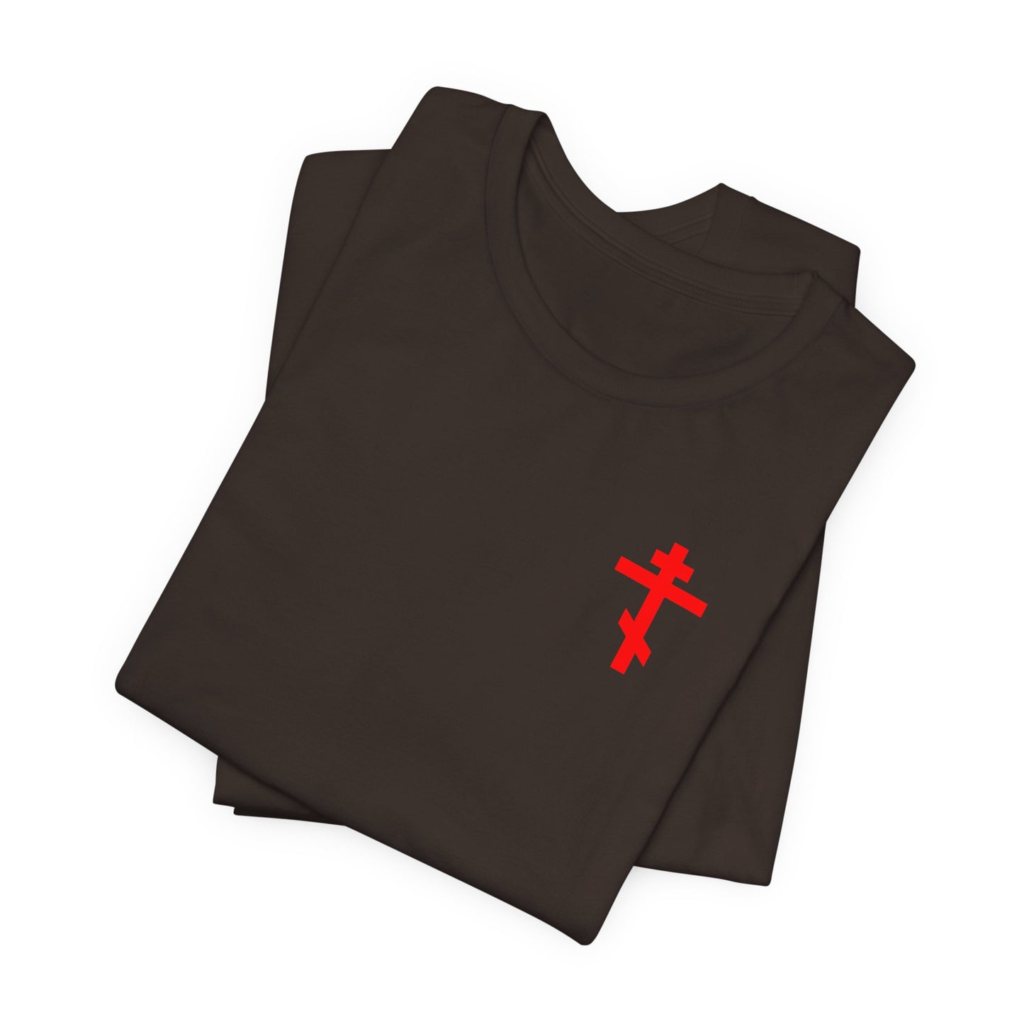 Brown lightweight cotton unisex tee, folded, featuring a small red Eastern Orthodox cross on the front left breast—perfect for those who cherish Divine Life and want a subtle way to celebrate their conversation with God. This is the Idoloclast Idol Smasher Hammer shirt, with Jesus NIKA fist holding hammer graphic on the back.