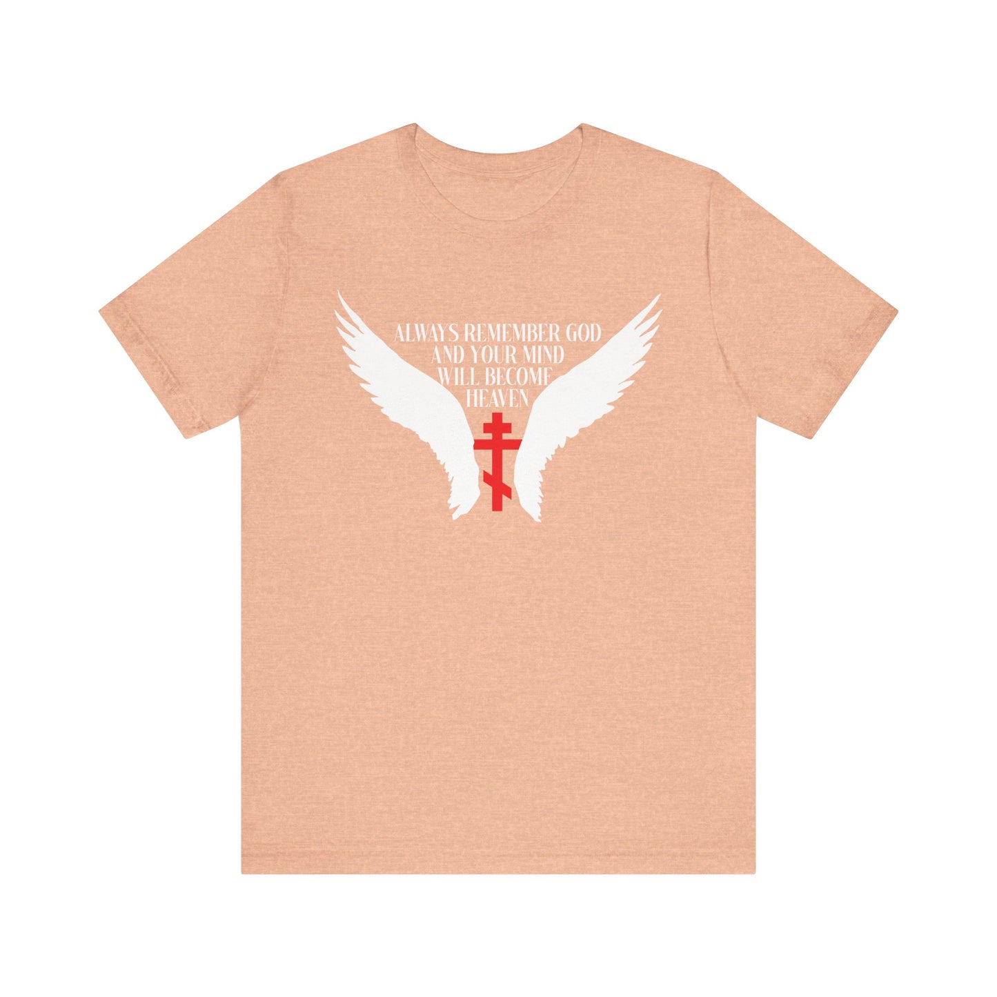 Heather peach unisex tee featuring white angel wings, an Orthodox cross, and "Always Remember God and Your Mind Will Become Heaven"—inspired by Fr Spyridon Bailey’s teachings. Lightweight cotton, Christian-themed design.