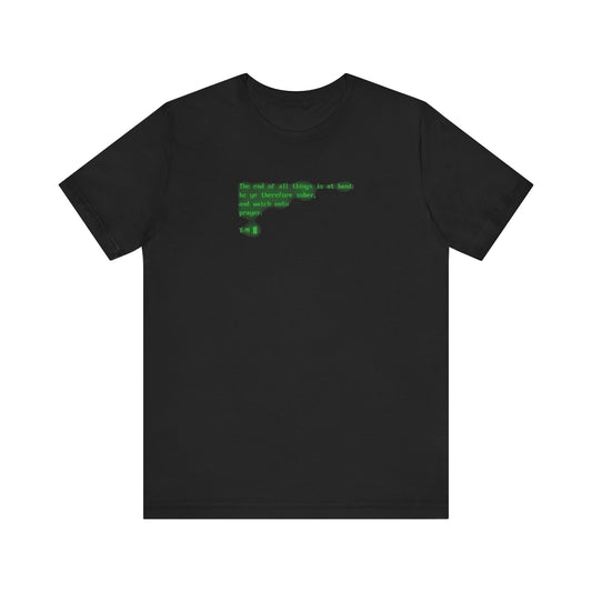 Black t-shirt featuring the phrase "The end of all things is at hand: be ye therefore sober, and watch unto prayer" in green pixelated text across the upper center, designed in a CRT retro screen style inspired by classic computer displays. Lightweight cotton unisex tee.