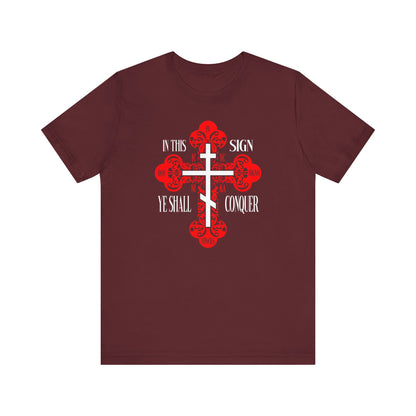 Maroon Christian Unisex Tee featuring an ornate Orthodox Cross with “In This Sign Ye Shall Conquer | In Hoc Signo Vinces | ICXC NIKA | Jesus Christ Conquers”—a bold nod to faith and spiritual victory.