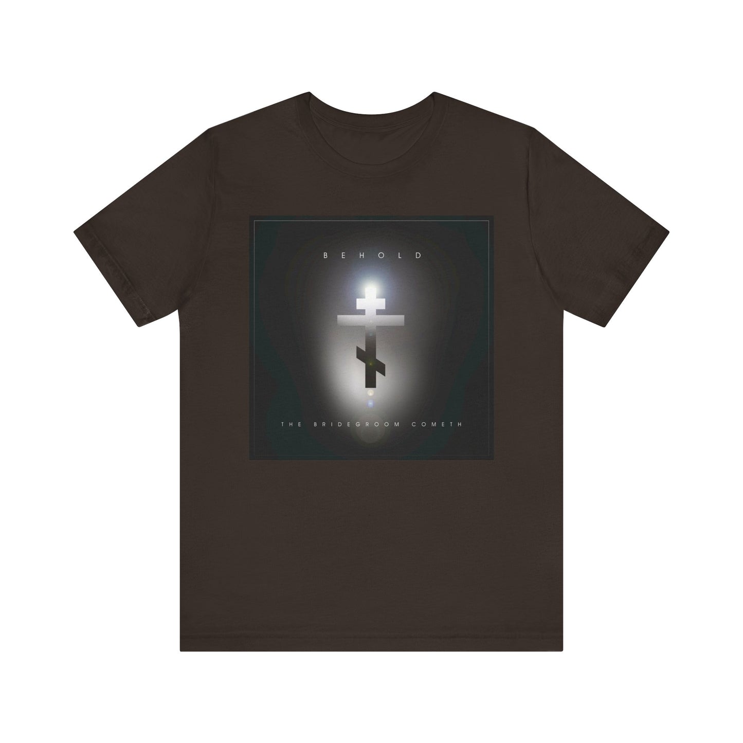 Brown "Behold the Bridegroom" Orthodox Christian t-shirt with minimalist cinematic lens flare cross, features "Behold" above and "The Bridegroom Cometh" below; crafted from lightweight cotton for unisex comfort.