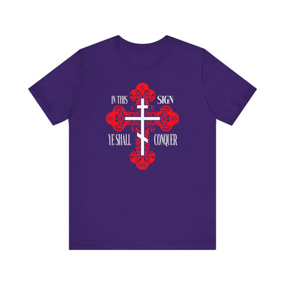 Team Purple unisex tee featuring an ornate Orthodox cross and the text “In This Sign Ye Shall Conquer”—a bold Christian statement of faith and victory in Jesus Christ.
