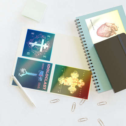 A notebook, pen, and Bestseller Mix No. 2 Four Orthodox Stickers are arranged on a white desk with paper clips.