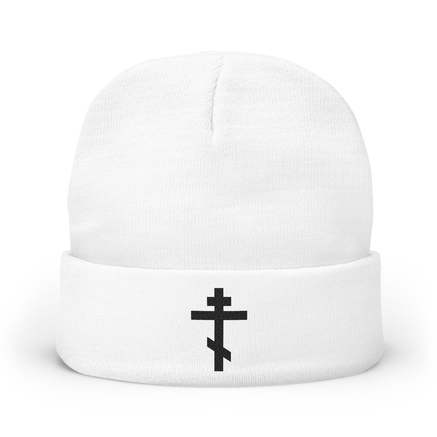 White knit beanie featuring a bold black Orthodox TriBar Cross and the text "Nail My Passions to the Wood of Thy Precious Cross O Lord" embroidered on the front. Perfect for Orthodox Christians.