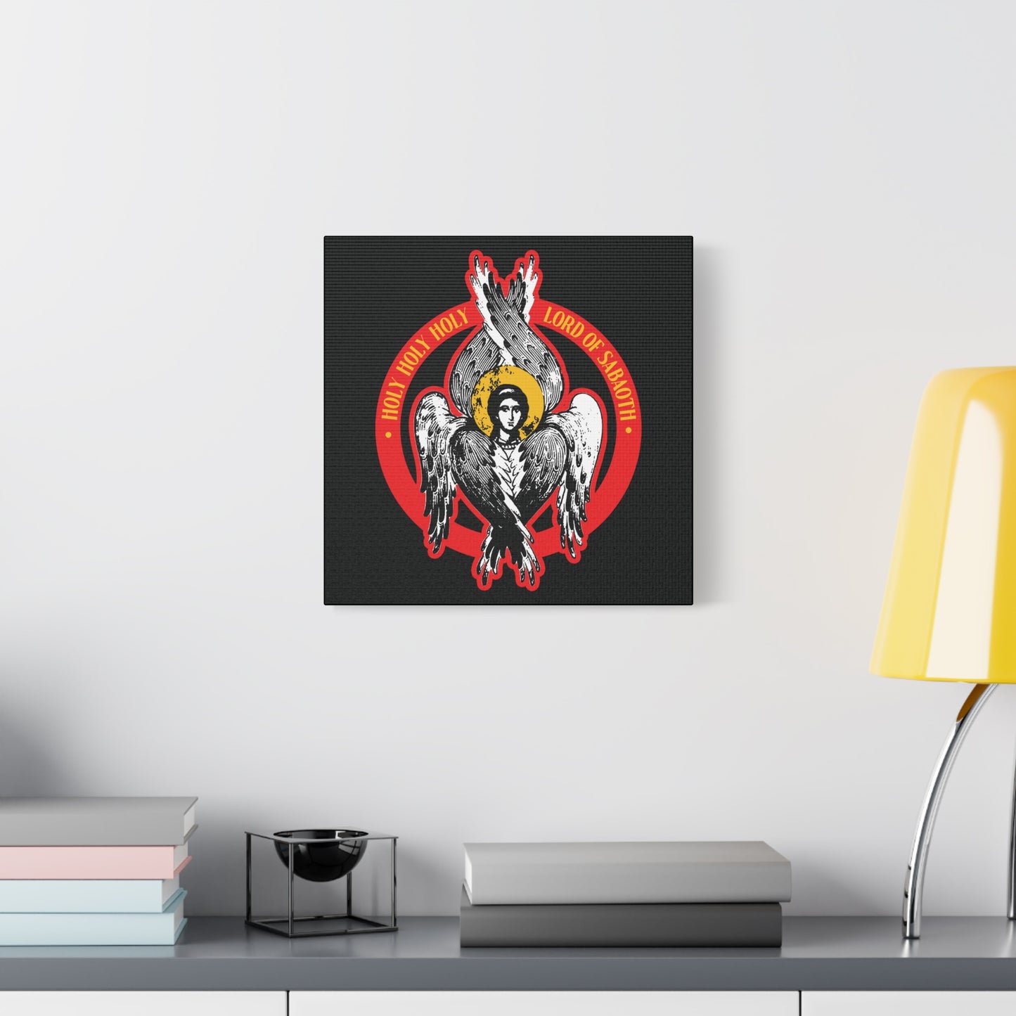 The "Holy Holy Holy, Lord of Sabaoth" Orthodox Seraphim Angel IconoGraphic is a Christian wall art print inspired by Isaiah 6, featuring a six-winged seraphim with a halo—perfect above a table with books and a yellow lamp.