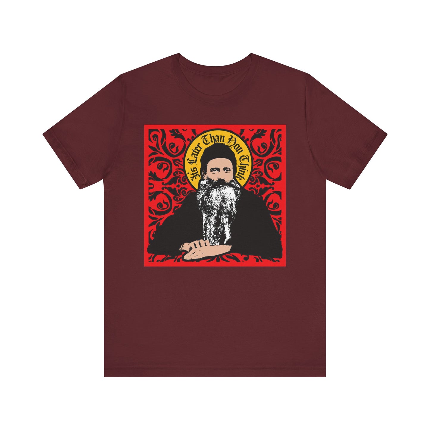 Maroon unisex tee: "It's Later Than You Think" in red ornate design featuring Saint Seraphim Rose of Platina in icono-graphic style—perfect for Orthodox Christians and fans of Orthodoxy. Lightweight cotton.