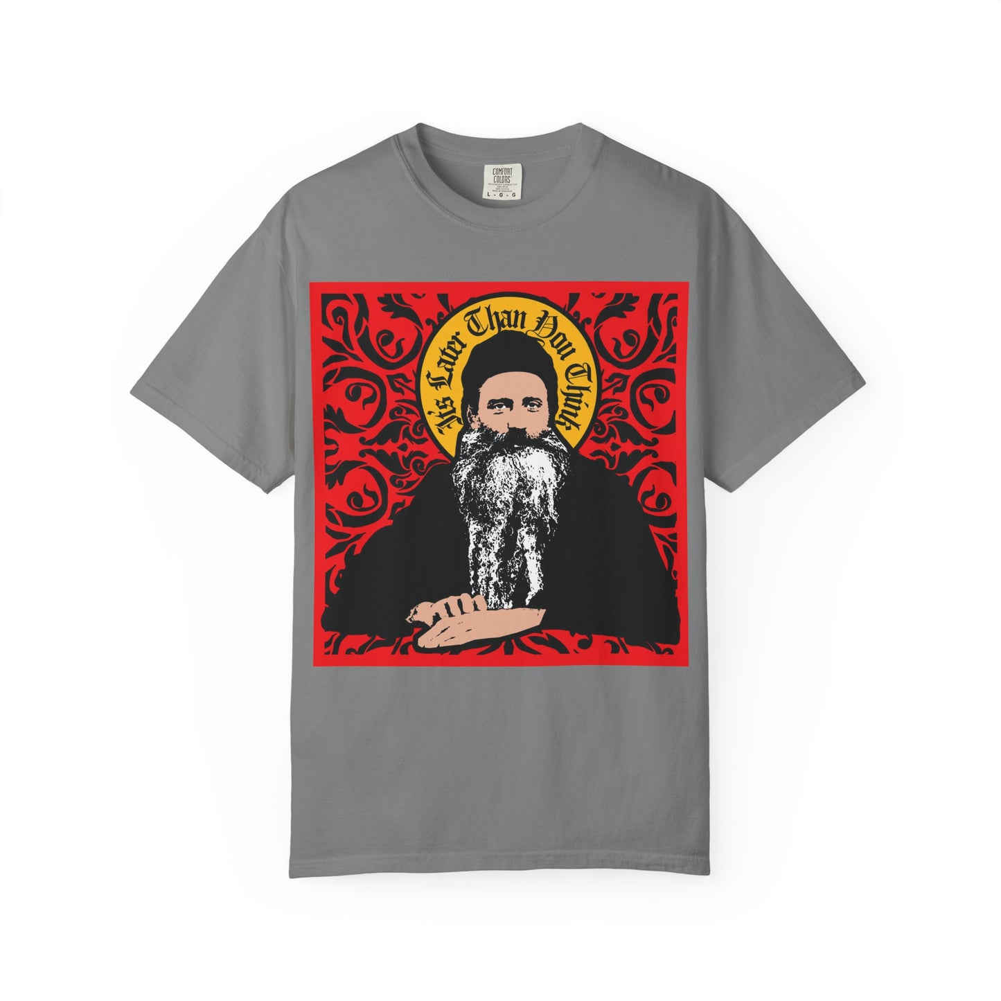 Grey heavyweight cotton unisex tee titled "It's Later Than You Think," featuring a Saint Seraphim Rose of Platina icono-graphic style design in red ornate detail with decorative text above—a thoughtful tribute to the spiritual heritage of Orthodoxy.