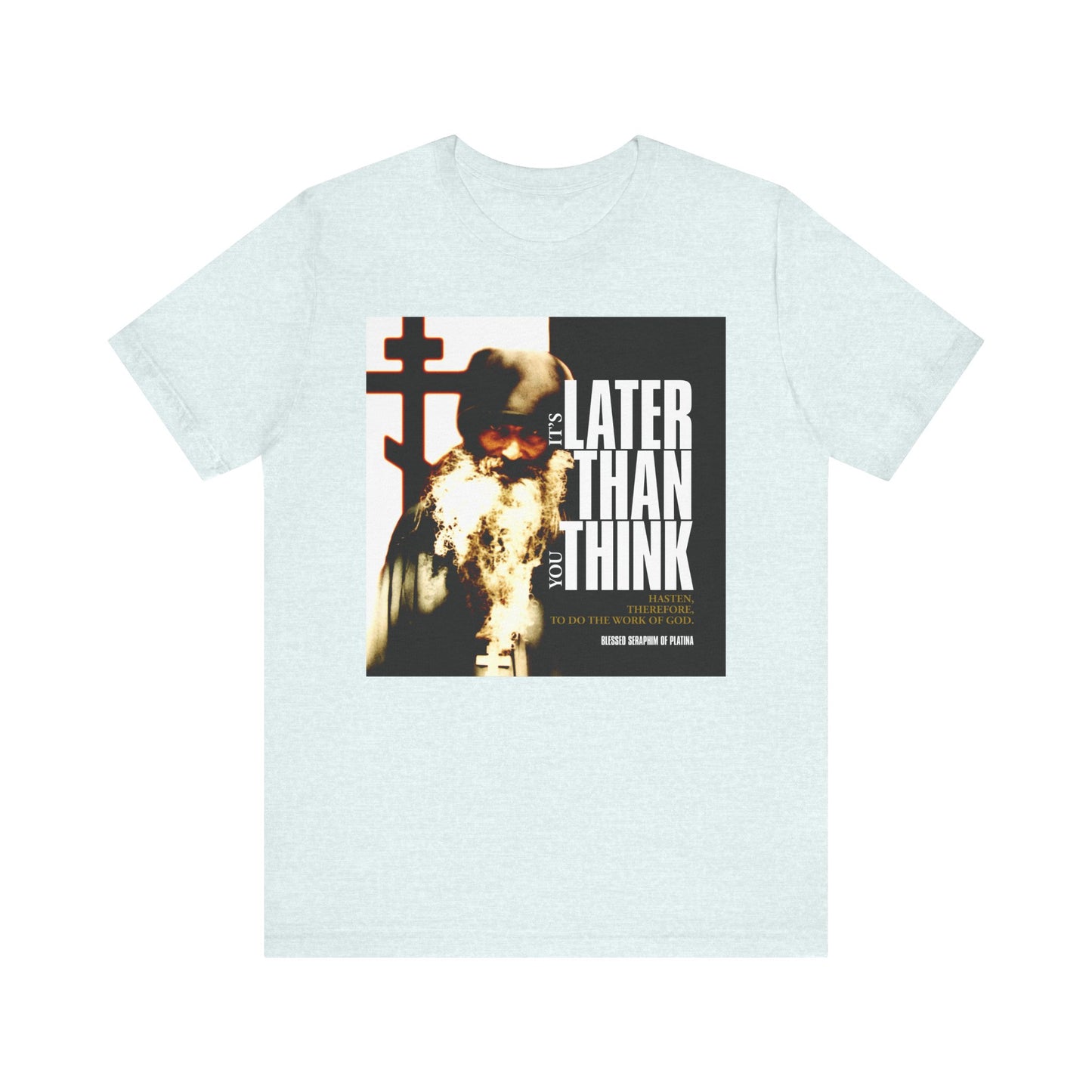 Heather Ice Blue unisex t-shirt with St Seraphim Rose photo and bold modern poster text: “It's Later Than You Think”—an Orthodox message on life and faith. Lightweight cotton, cinematic typography.