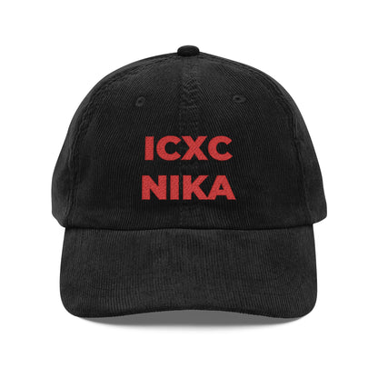 Black corduroy cap with red embroidered ICXC NIKA Christogram text, meaning "Jesus Christ Conquers." Orthodox Christian symbol; product name: Red ICXC NIKA Text Christogram Cap. Embroidered on soft black cotton.
