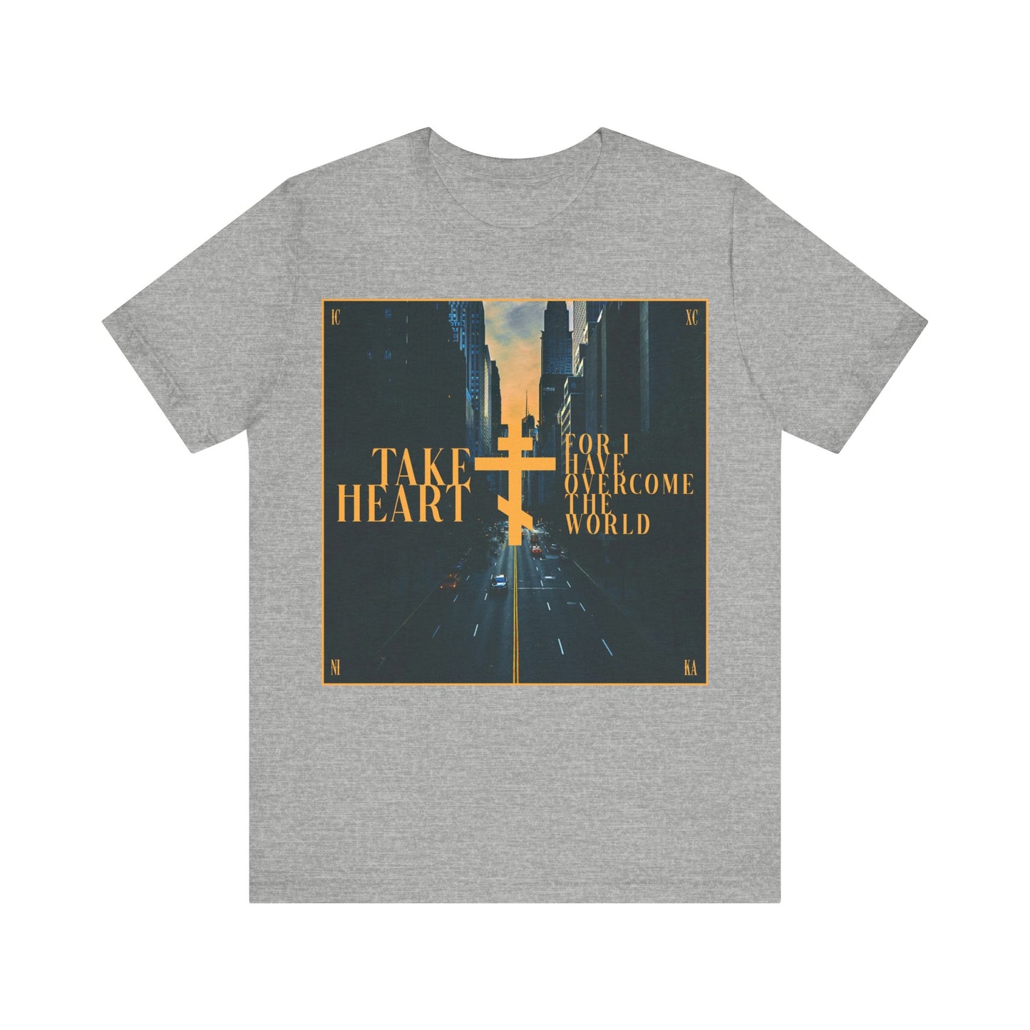Athletic Heather t-shirt featuring a modern city street scene and cross, with “Take Heart, For I Have Overcome the World” (John 16:33)—a reminder of hope and joy. Orthodox Christian cotton tee.