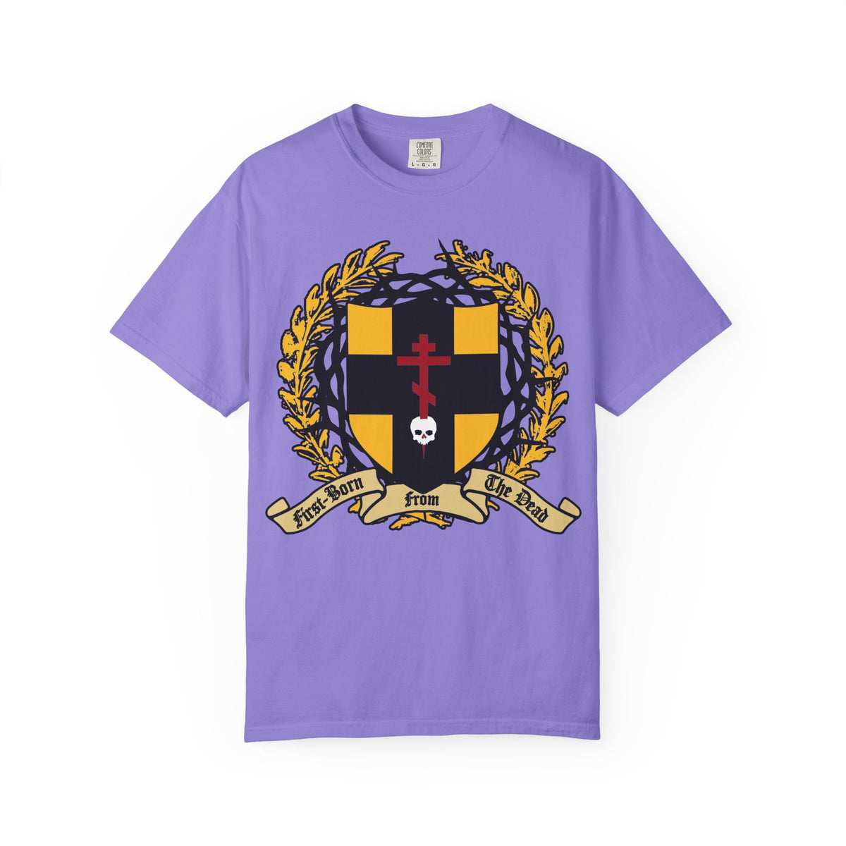 Violet heavyweight cotton unisex t-shirt featuring a heraldic shield with a gold Orthodox cross piercing a skull, crowned with thorns, and adorned with a gold wreath and banner reading “First-Born from the Dead (Col 1:18)”—a reference to redemption through Christ’s blood and the Exodus story of Egypt’s firstborn.