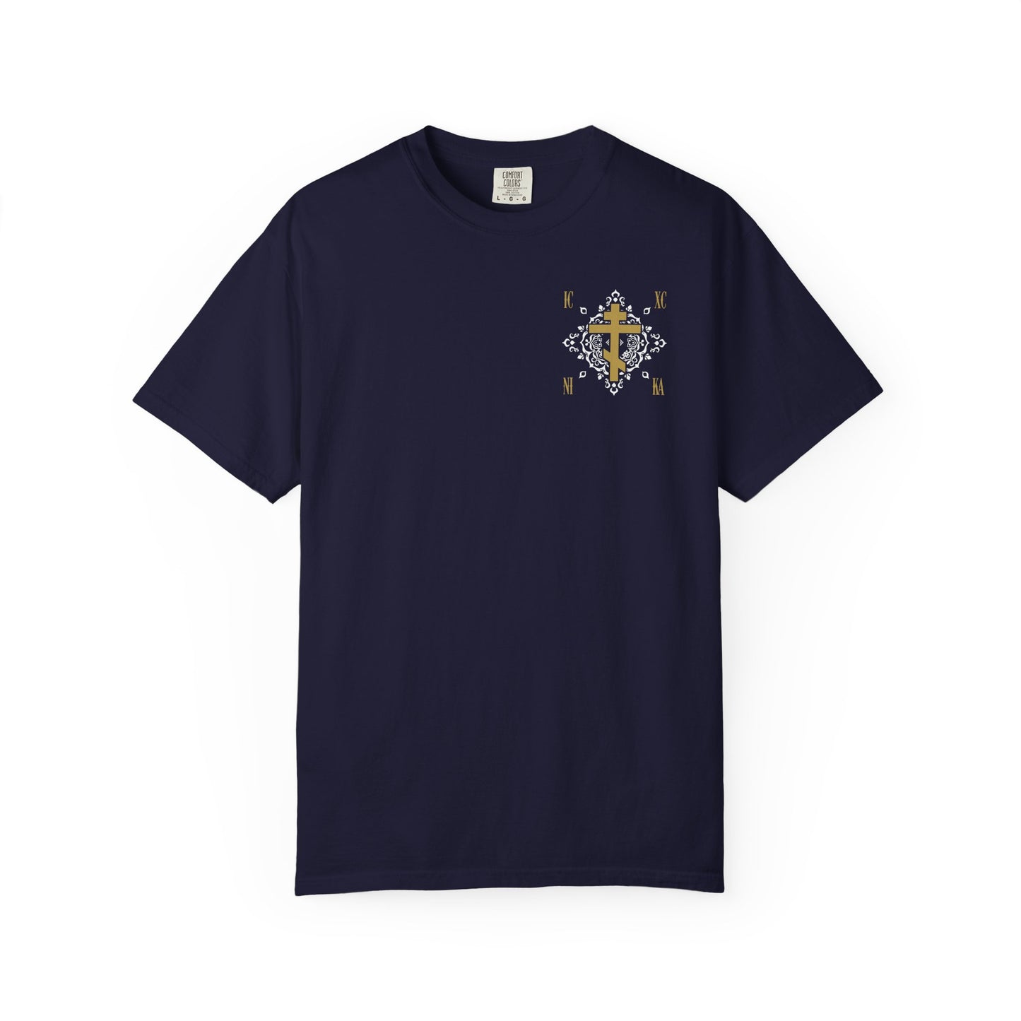 True Navy heavyweight cotton unisex t-shirt featuring a small gold Orthodox Cross ICXC NIKA with a white medieval ornate floral pattern and "Jesus Christ Conquers" design on the left chest.