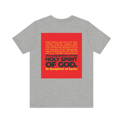 A gray cotton unisex tee with a red square on the back, featuring St Seraphim of Sarov’s bold quote: “True Aim of Christian Life is Acquisition of the Holy Spirit.” A thoughtful Orthodox reminder for any believer.