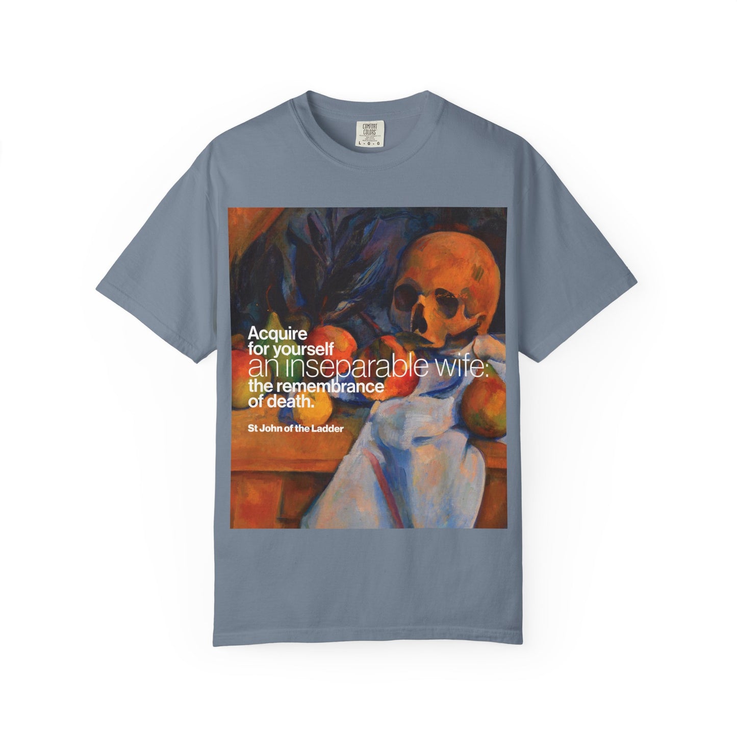 Blue Jean heavyweight cotton unisex t-shirt, titled “Acquire an Inseparable Wife (St John Climacus),” featuring Cezanne’s still life with a skull and Orthodox Christian art inspired by the tradition of remembrance of death, with the quote: “Acquire for yourself an inseparable wife...”.