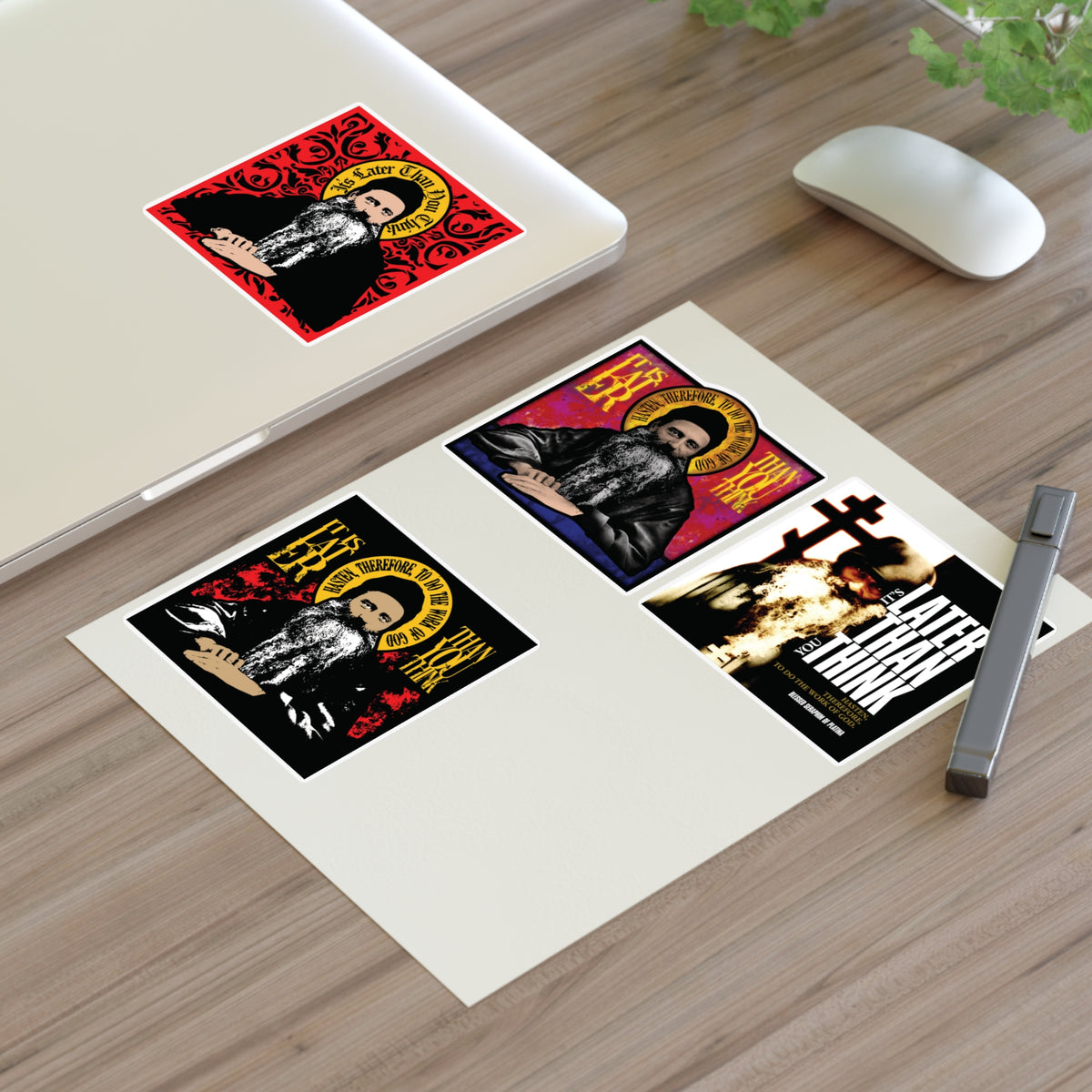 Fr Seraphim Rose Four Sticker Sheet No. 1 is shown on a desk next to a pen and laptop.