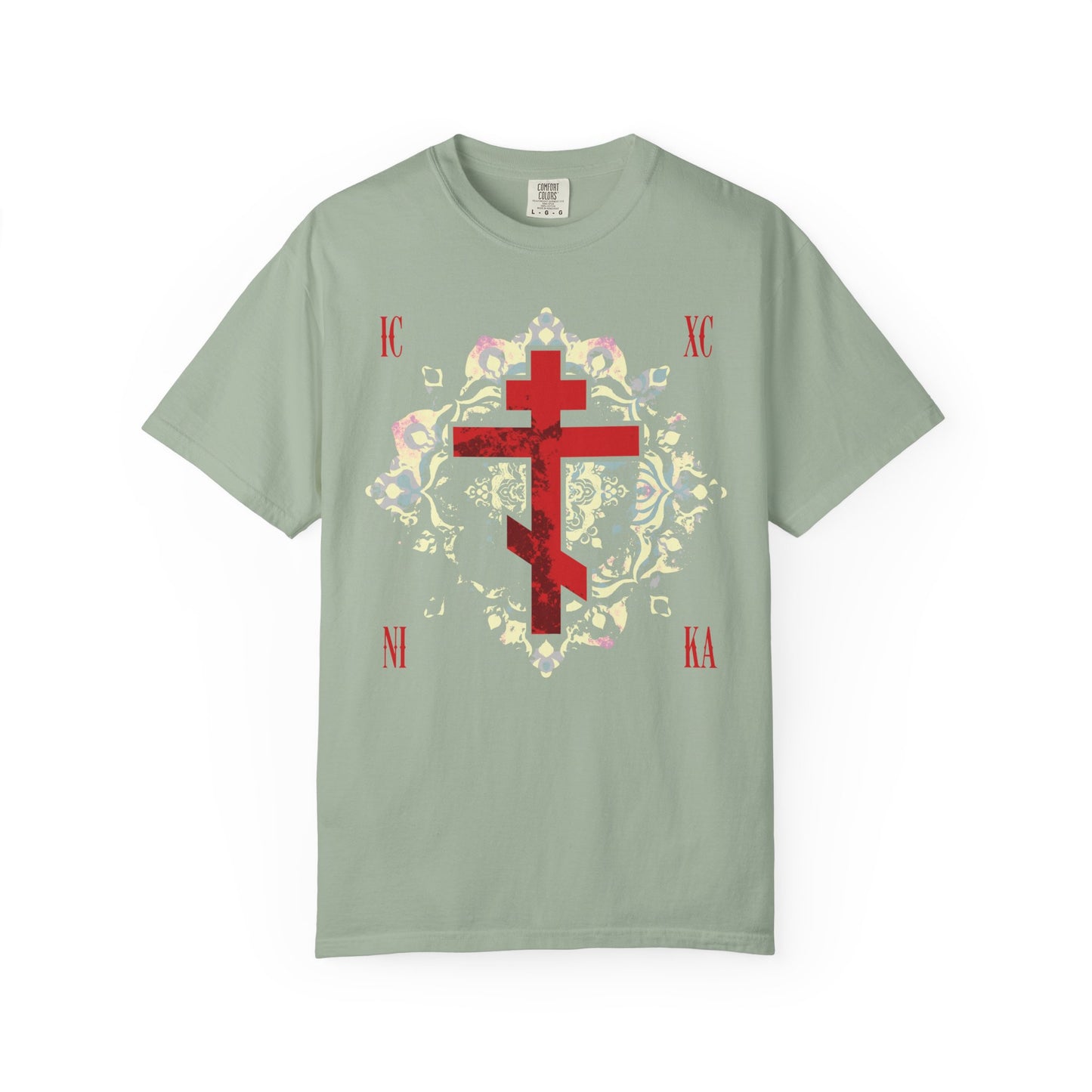 Bay heavyweight cotton unisex tee featuring a textured red Orthodox cross with medieval floral background and IC XC NI KA text—Jesus Christ Conquers—a tribute to spiritual endurance and victory.
