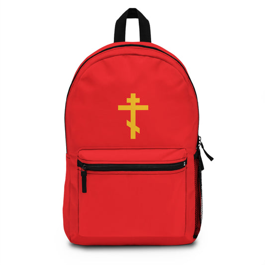 Orthodox Christian backpack featuring a yellow Orthodox cross on a red background—"Precious and Life-Giving Weapon of Unseen Warfare, Scourge of Demons." Inspired by the message of being crucified with Christ (Galatians 2:20).