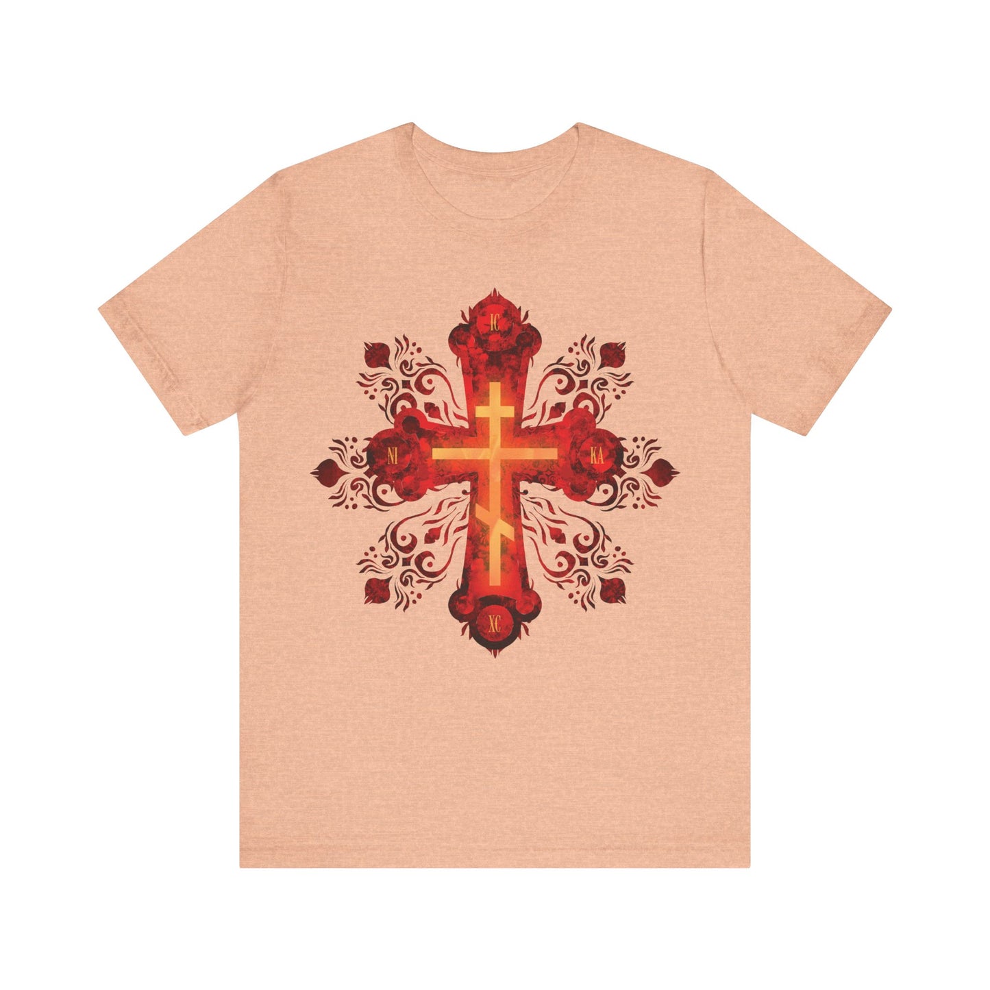 Heather peach unisex cotton tee featuring a large ornate red and gold Russian-style Orthodox cross and the message "He was pierced for our transgressions," inspired by St. Herman of Alaska and Christian warrior spirit.