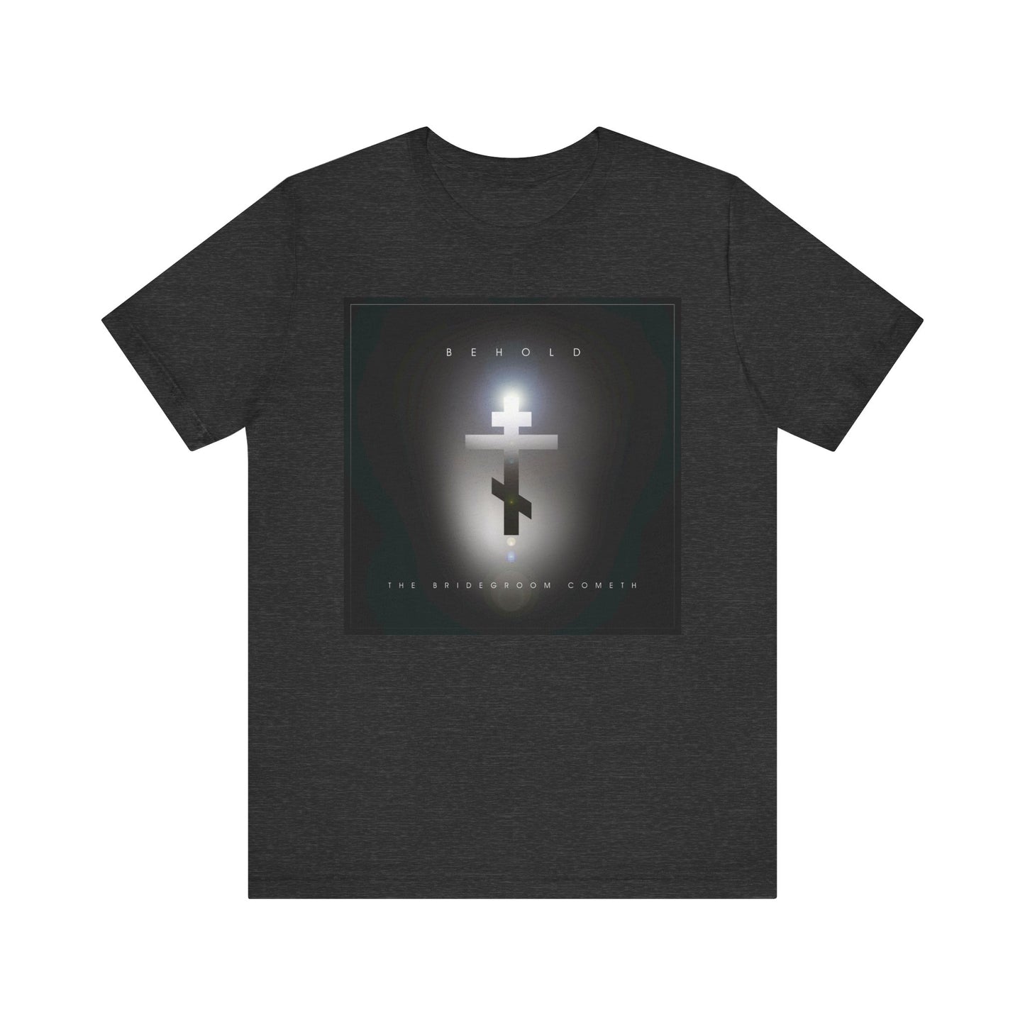 Dark Grey Heather unisex t-shirt featuring a minimalist cinematic lens flare Orthodox cross and the text BEHOLD and THE BRIDEGROOM COMETH—a reminder to "watch," as the day of judgment may come unexpectedly. Lightweight, cotton, Christian apparel.
