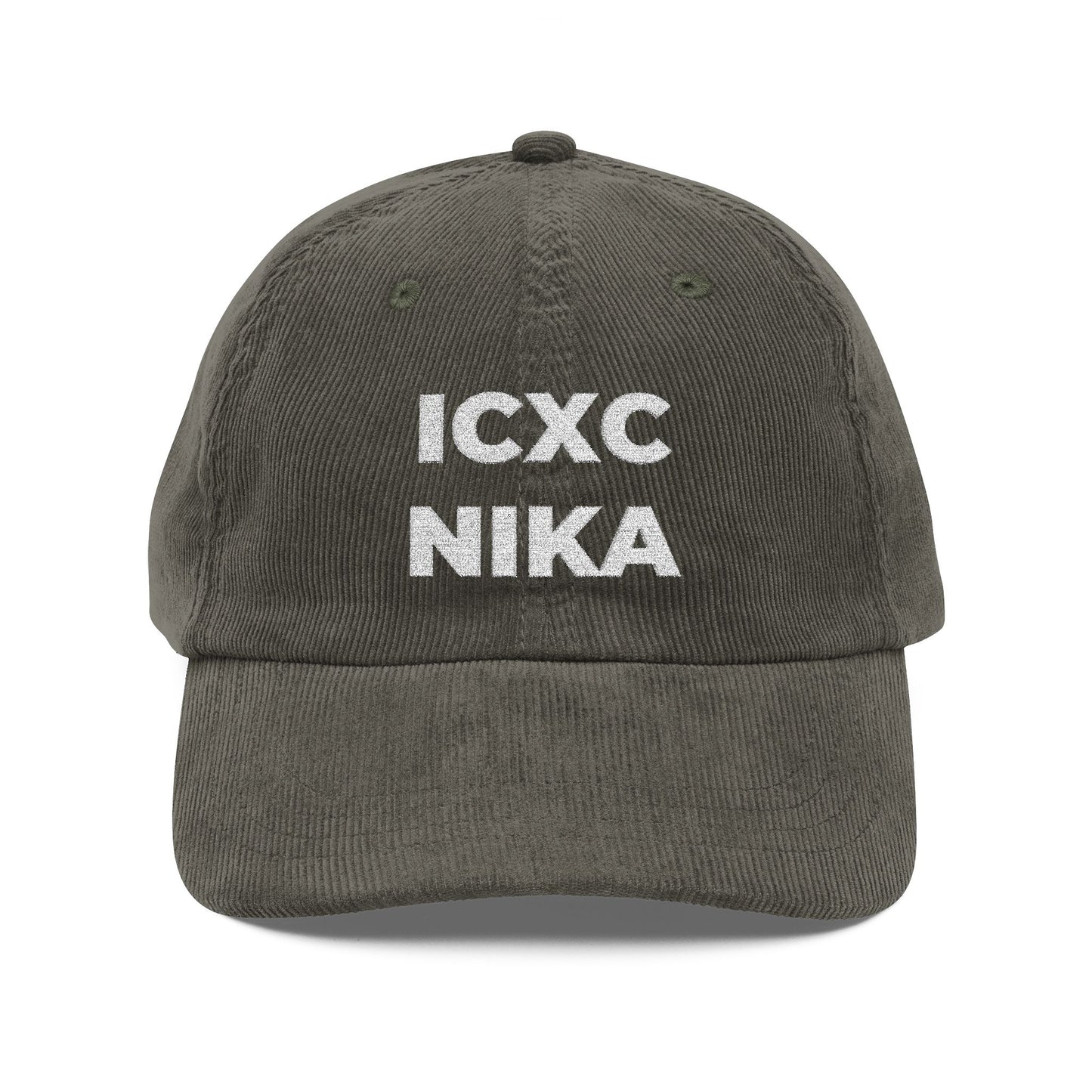 An olive cotton corduroy cap with "ICXC NIKA"—Greek for "Jesus Christ Conquers"—embroidered in white on the front.